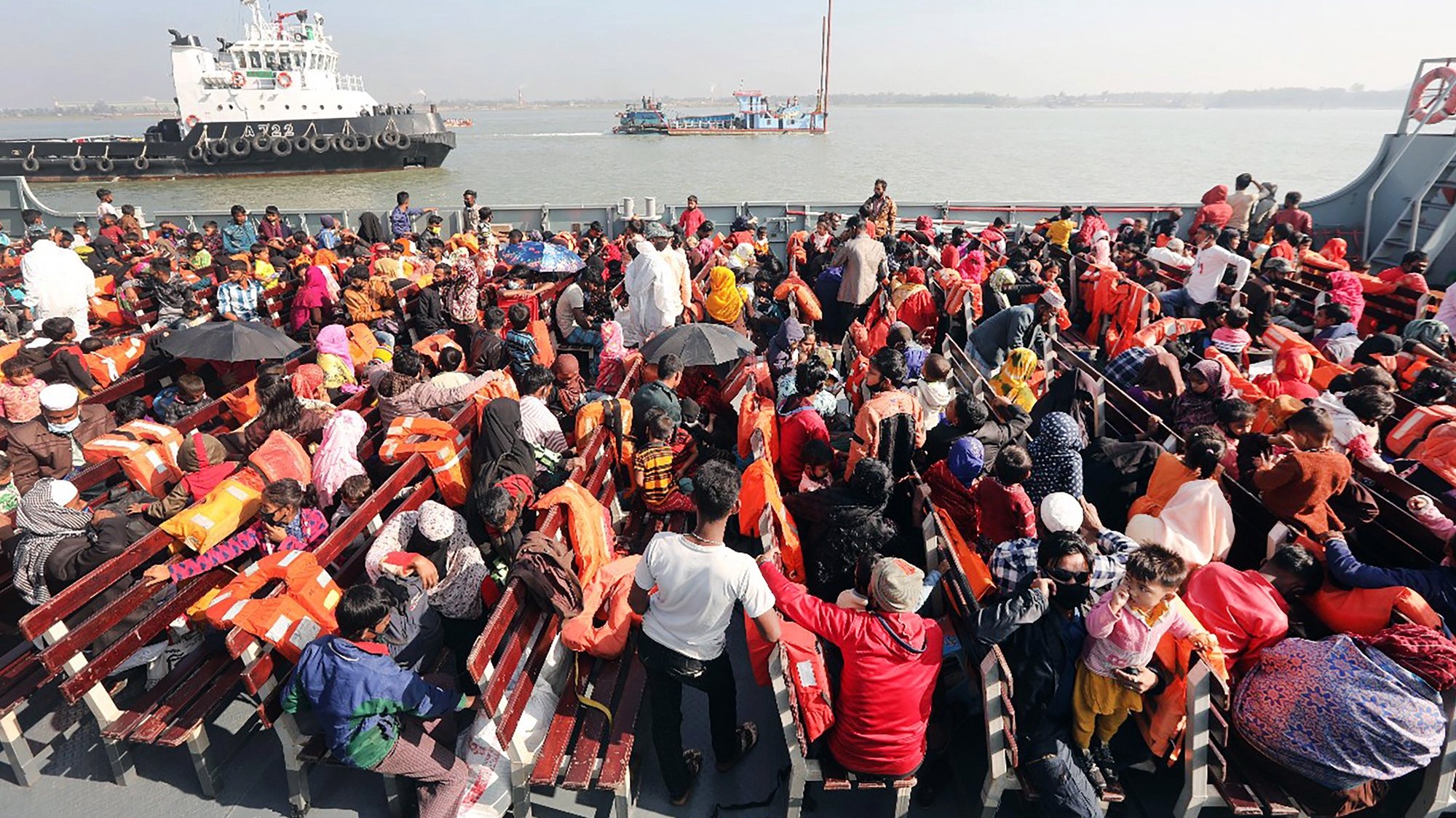 epa08972342 A Rohingya refugees sit on board a naval ship that will take them to Bhashan Char Island, in Chittagong, Bangladesh 29 January 2021. A third group of Rohingya refugees is being relocated to Bhashan Char island under the district of Noakhali.  EPA/STR
