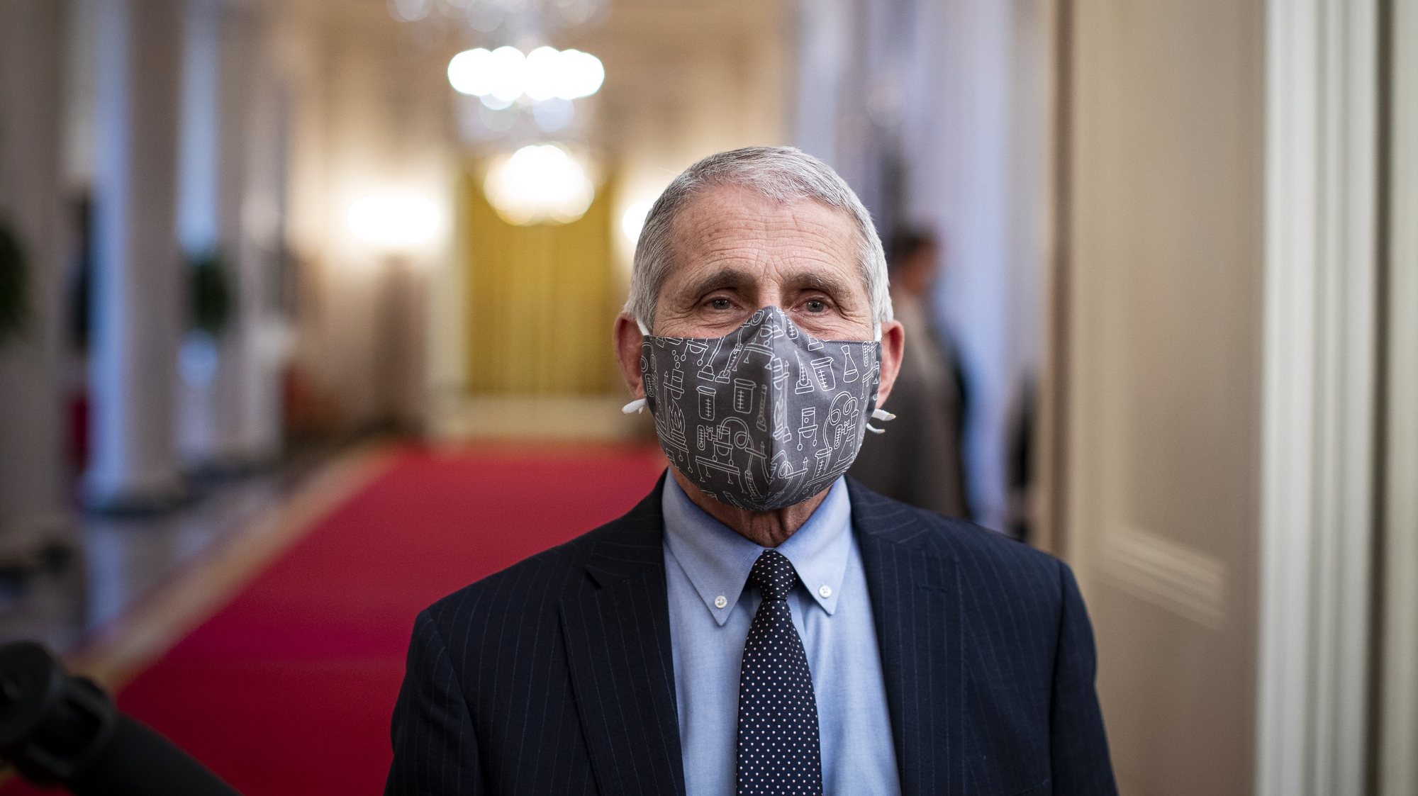 epa08956683 Anthony Fauci, director of the National Institute of Allergy and Infectious Diseases, wears a protective mask while speaking to members of the media before an event on the Biden administration&#039;s Covid-19 response in the State Dining Room of the White House in Washington, DC, USA, on 21 January 2021. Biden in his first full day in office plans to issue a sweeping set of executive orders to tackle the raging Covid-19 pandemic to rapidly reverse or refashion many of his predecessor&#039;s most heavily criticized policies.  EPA/Al Drago / POOL