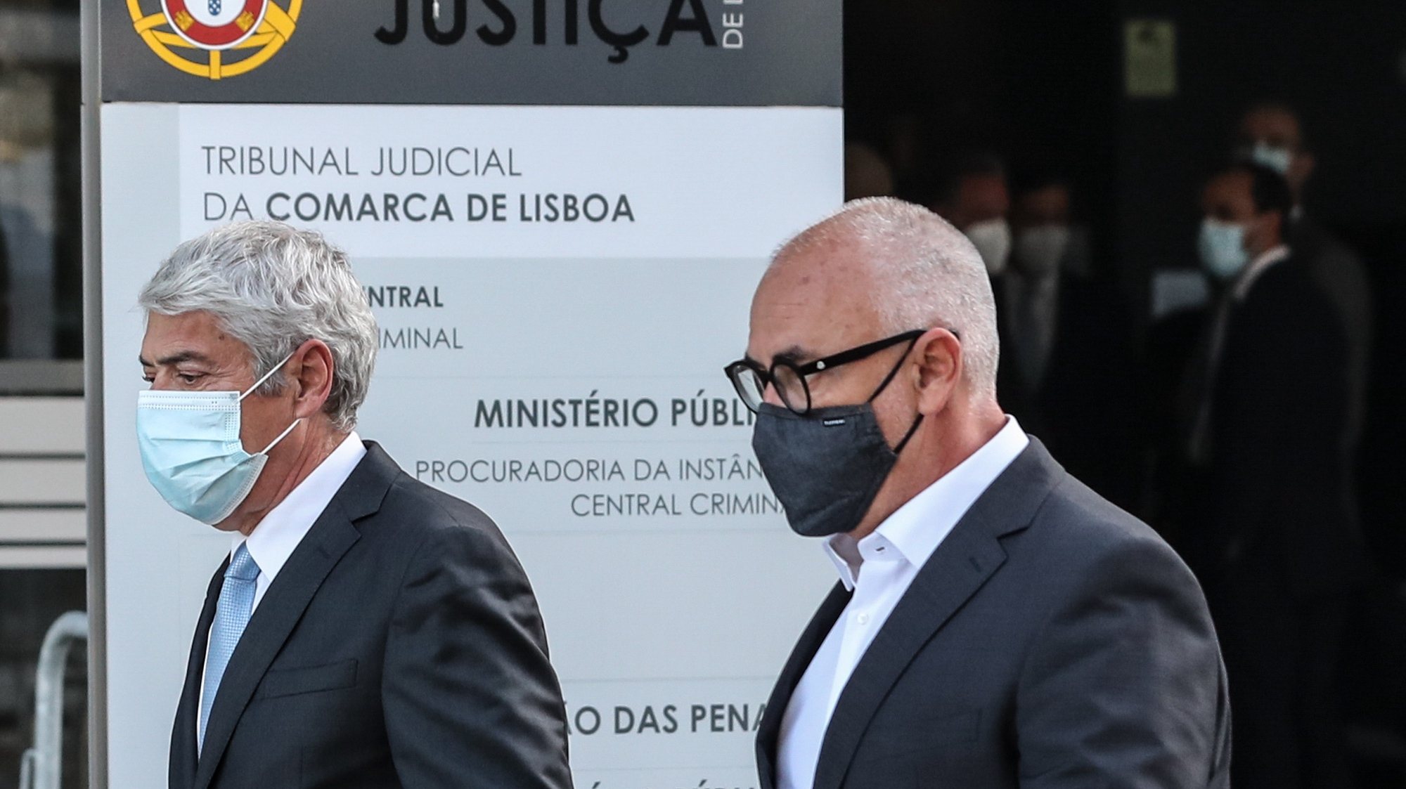 epa09125086 The defendant and former Prime Minister Jose Socrates (L) and his lawyer Pedro Delille (R) leave the court after the reading of the instructional decision of the high-profile corruption case known as Operation Marques, at the Justice Campus in Lisbon, Portugal, 09 April 2021. Operation Marques has 28 defendants - 19 people and 9 companies - including former Prime Minister Jose Socrates, banker Ricardo Salgado, businessman and friend of Socrates Carlos Santos Silva, and senior executives of Portugal Telecom, and is related to crimes of active and passive corruption, money laundering, document forgery, and tax fraud.  EPA/ANTONIO COTRIM
