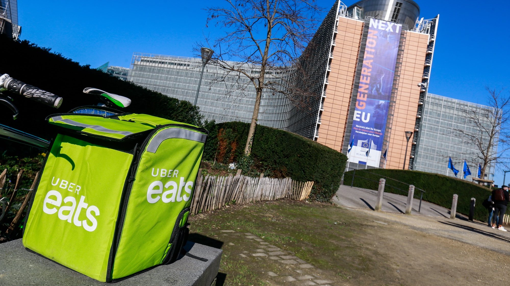 epa09033370 An Uber eats delivery box during the gathering of different trade union organizations for the International Platform Workers Action Day in front of the European Commission in Brussels, Belgium, 24 February 2021. The European Commission begins a consultation on 24 February in its initiative to help improve the working conditions of Platform workers. The trade unions and the Belgian courier collective call on the Commission to go in the direction of the demands and the interests of the workers, not of the platforms. The same type of action takes place in 15 different countries on the same day.  EPA/STEPHANIE LECOCQ