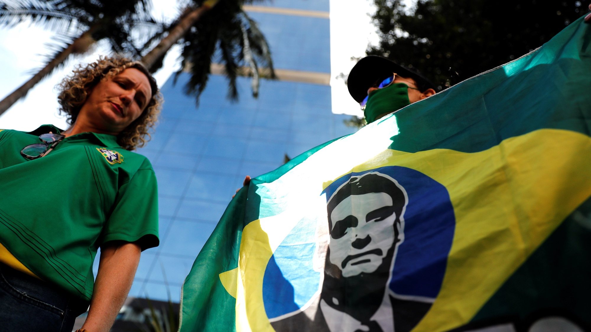 epa09346764 Groups of supporters of the President of Brazil Jair Bolsonaro carry out an act of support in front of the Vila Nova Star hospital, in Sao Paulo, Brazil, 15 July 2021. Bolsonaro &#039;evolves&#039; favorably after undergoing a treatment to unblock his intestine and, if he continues like this, he will not need to undergo surgery, his son Senator Flavio Bolsonaro reported on 15 July.  EPA/Sebastiao Moreira