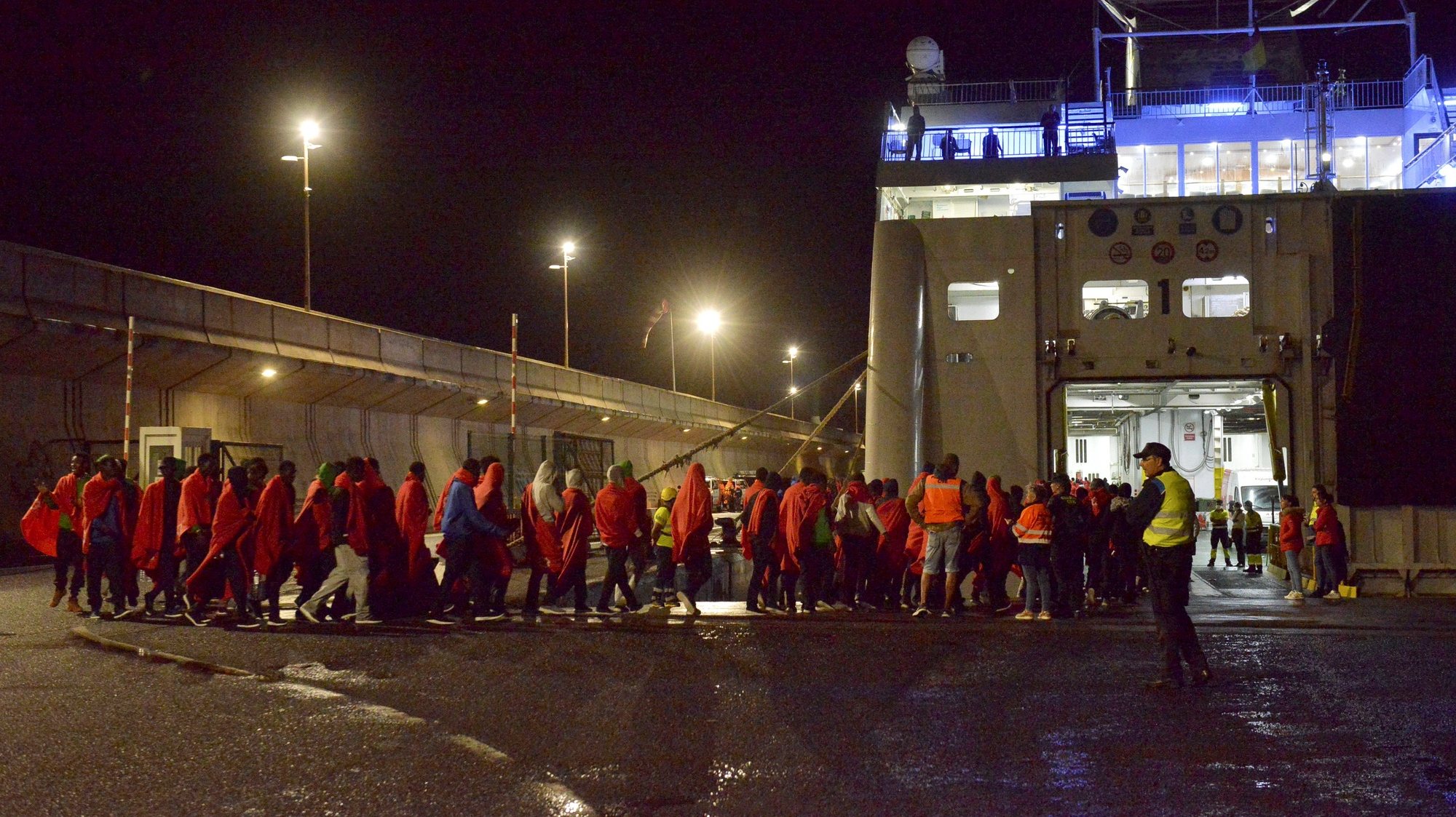 epa10932254 Some 800 migrants that arrived at the port of La Restinga in four irregular boats, onboard a ferry in La Estaca port in Valverde, El Hierro Island, Spain 21 October 2023, to be referred to care sources on Tenerife Island (issued 22 October 2023).  EPA/Gelmert Finol