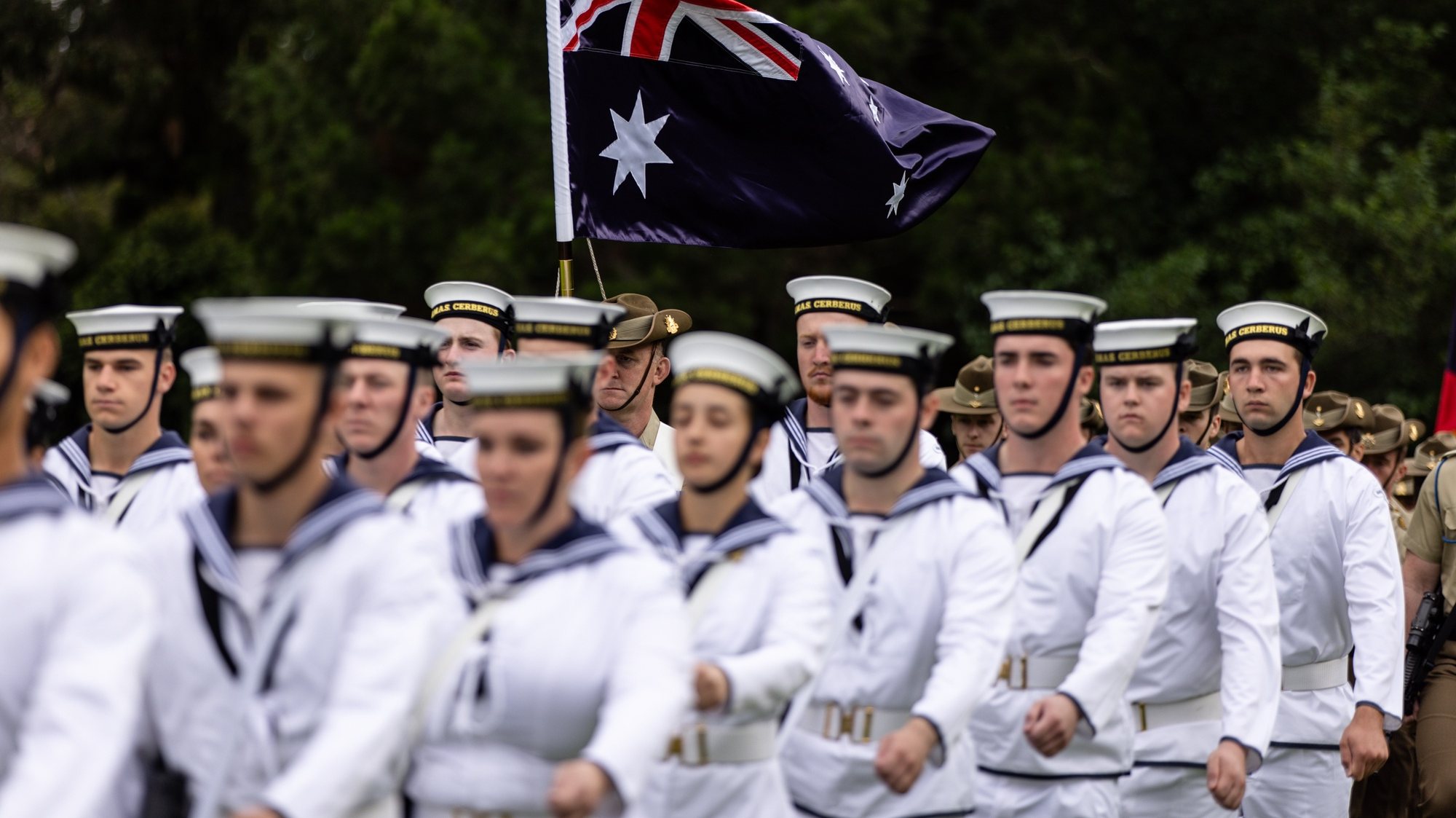 epa11104563 ADF Tri-Service Royal Guard of Honor and members of the Royal Australian Navy Band attends a flag raising ceremony at Government House on Australia Day in Melbourne, Australia, 26 January 2024. Australia Day, the official national day of Australia, is celebrated every year on 26 January. It commemorates the 1788 landing of the First Fleet and the raising of Great Britain&#039;s Union. Some people view it as a day of reflection, suggesting a change of date or even abolishing the holiday altogether. While changing the date has minority support, polls show some backing, especially among Australians under 30.  EPA/DIEGO FEDELE NO ARCHIVING AUSTRALIA AND NEW ZEALAND OUT