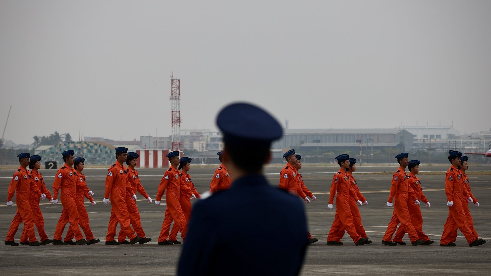 epa11005207 Taiwan Air Force pilots walk on the tarmac during the Air Force Flight Training Command Formation Ceremony at an airbase in Kaohsiung, Taiwan, 01 December 2023. As part of the ongoing military tension between China and Taiwan, there&#039;s been a notable increase in Chinese military aircraft incursions into Taiwan&#039;s airspace. The Taiwan Air Force is actively monitoring these situations, and responds by promptly scrambling fighter jets, such as the Mirage-2000 and F-16V, for interceptions. The Taiwan Advanced Jet Trainer (AJT) is being developed in Taiwan to replace the aging fleet of AT-3 and F-5 trainer aircraft.  EPA/RITCHIE B. TONGO