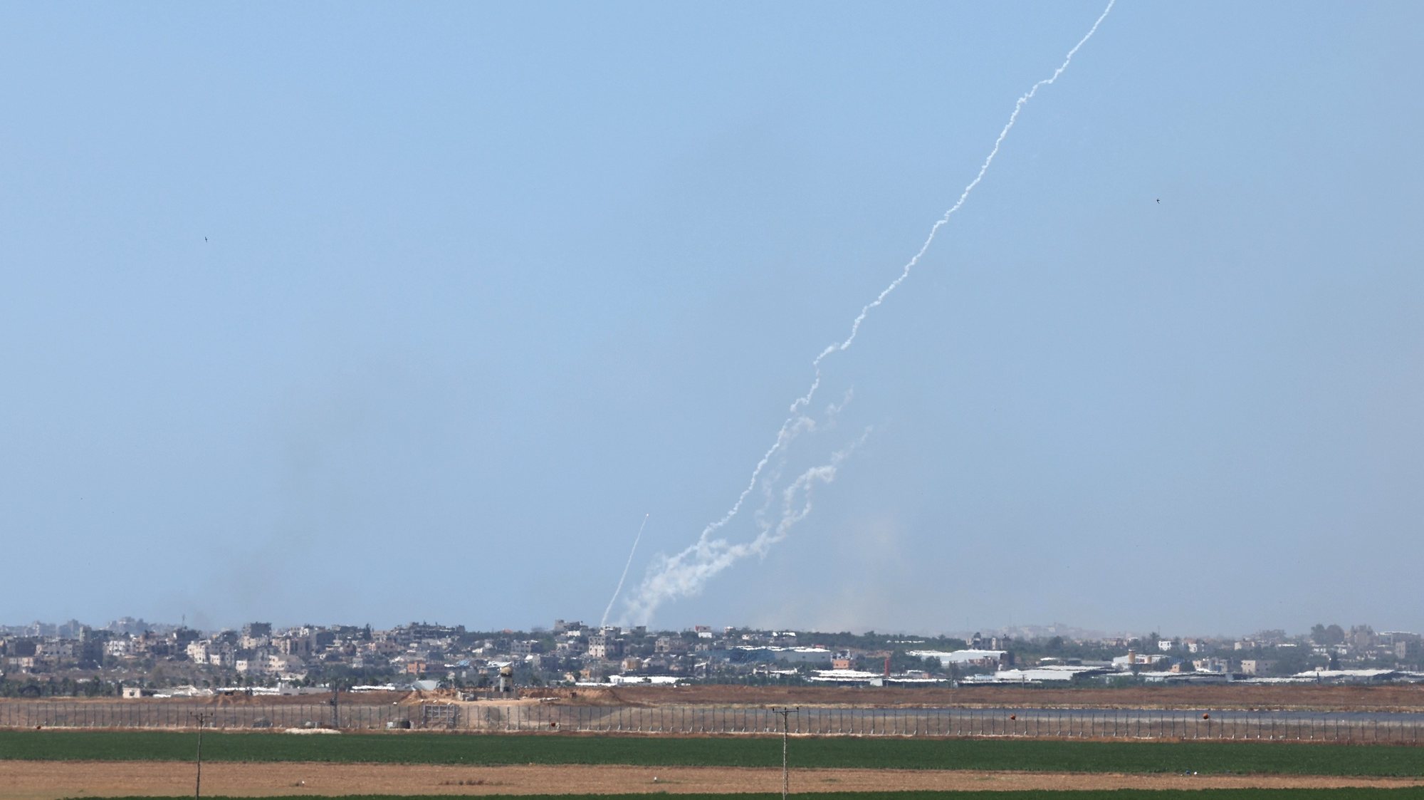 epa11339514 Rockets are launched from an area near Jabalia, northern Gaza Strip, towards the Israeli city of Sderot, as seen from the Israeli side of the border, southern Israel, 14 May 2024. The Israeli military stated on 14 May, that Israeli troops &#039;expanded&#039; their activity in the area of Jabalia overnight, and conducted &#039;targeted operations&#039; in the area. More than 35,000 Palestinians and over 1,455 Israelis have been killed, according to the Palestinian Health Ministry and the Israel Defense Forces (IDF), since Hamas militants launched an attack against Israel from the Gaza Strip on 07 October 2023, and the Israeli operations in Gaza and the West Bank which followed it.  EPA/ATEF SAFADI