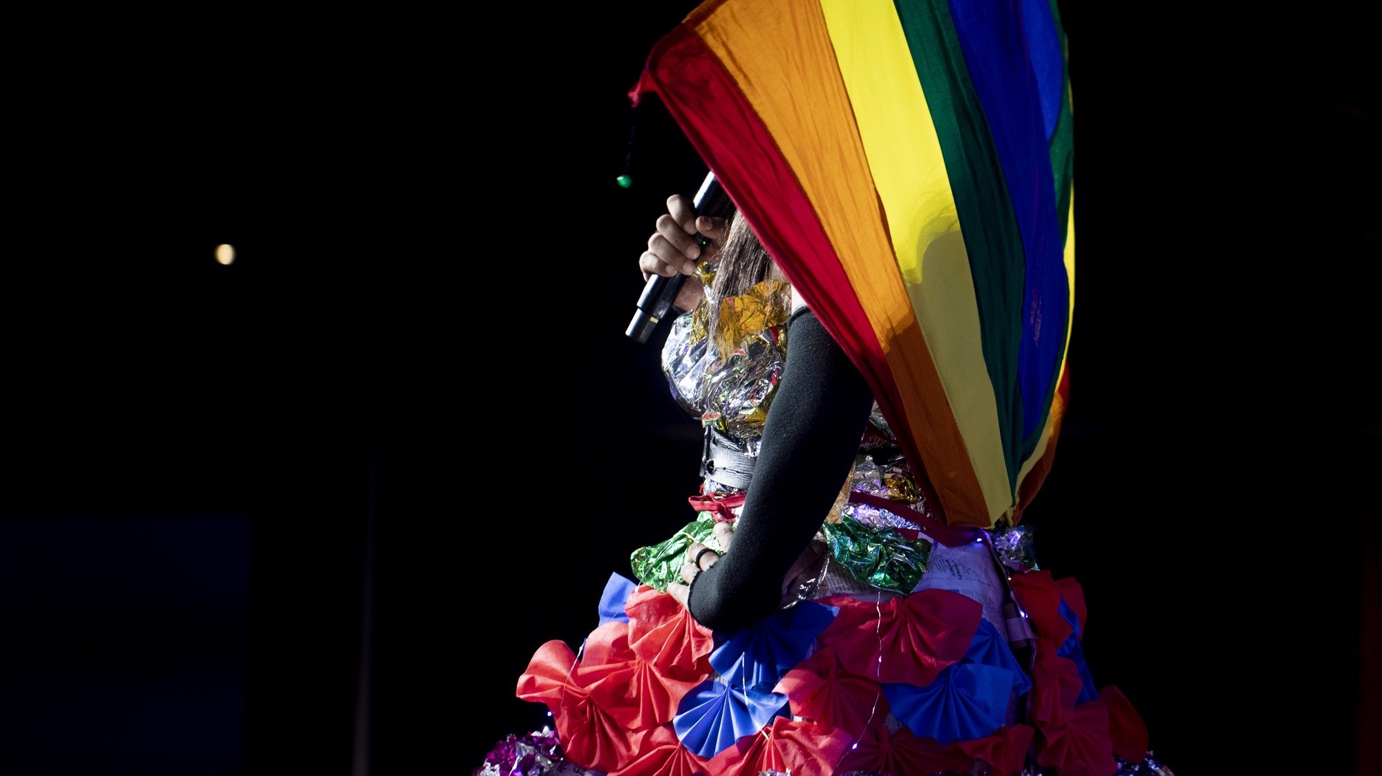 epa10695127 A participant wearing an outfit with a rainbow flag performs during a Drag Show in Kathmandu, Nepal, 16 June 2023. Hundreds of Nepalese youths and LGBTQIA activists participated in the Drag Show to honor the Pride month of June.  EPA/NARENDRA SHRESTHA