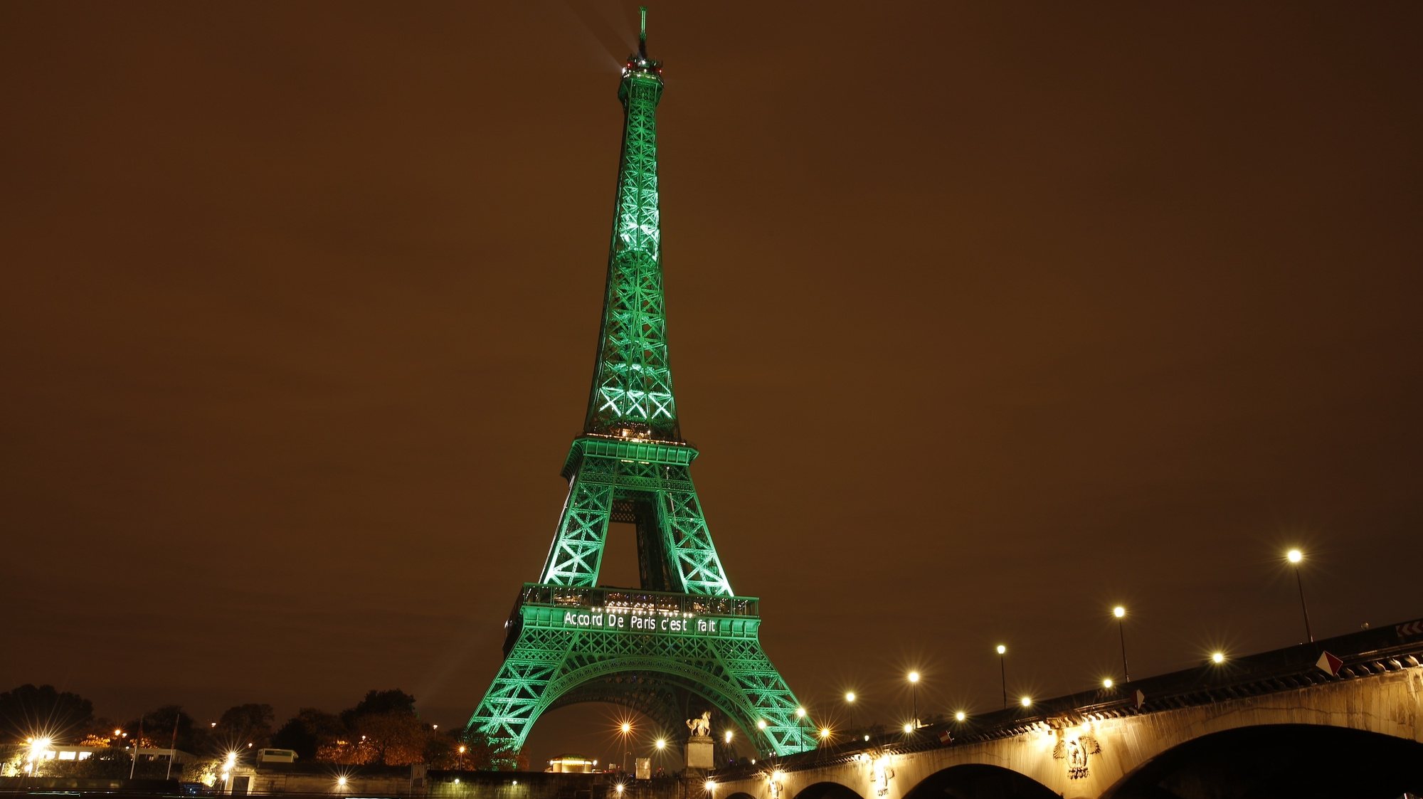 epa08954866 (FILE) - The Eiffel Tower is illuminated in green to celebrate the ratification of the COP21 (Conference of the Parties Climate Conference) climate change agreement in Paris, France, 04 November 2016 (reissued 21 January 2021). US President Joe Biden in the first hours in office signed several executive orders reversing policies of his predecessor including on the coronavirus pandemic, the Paris climate agreement and Trump&#039;s controversial border wall.  EPA/YOAN VALAT *** Local Caption *** 53104785