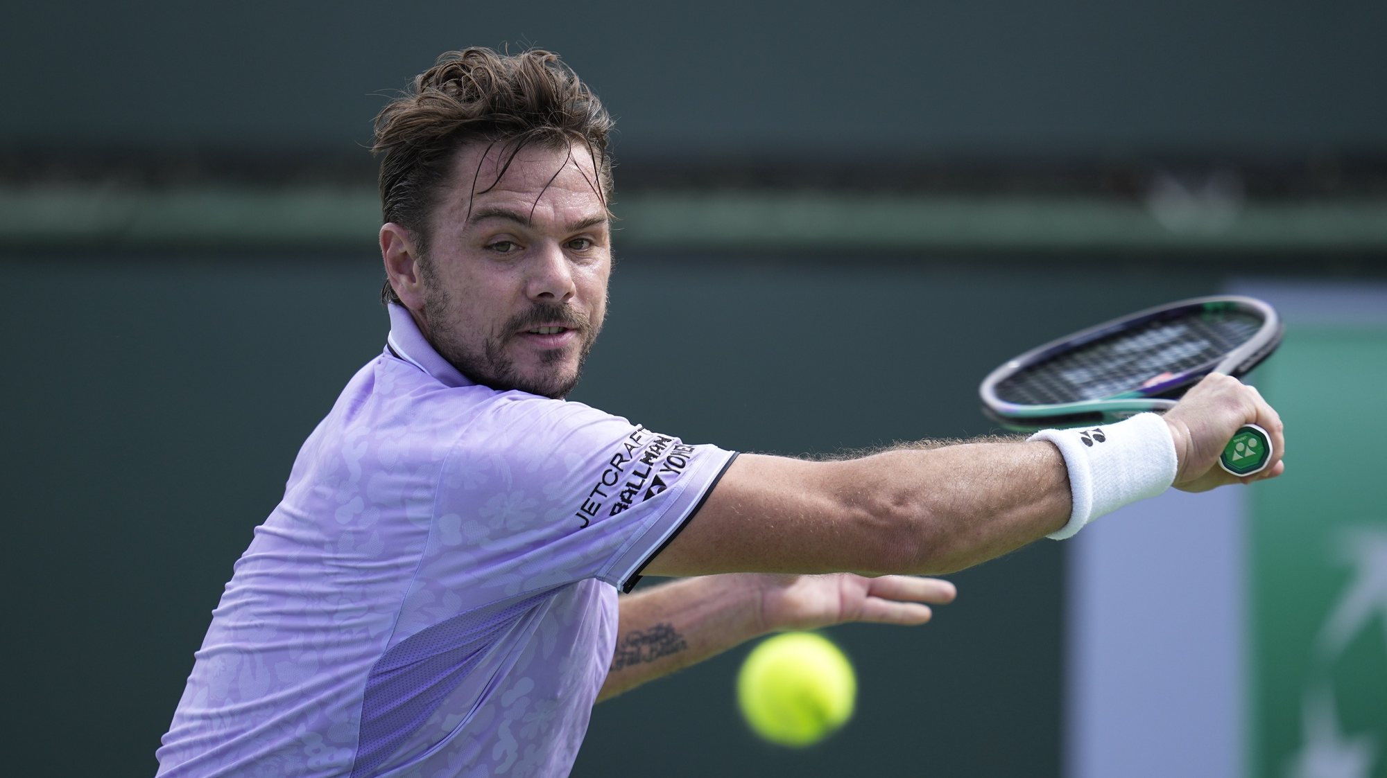 epa10516036 Stan Wawrinka of Switzerland in action against Miomir Kecmanovic of Serbia during the BNP Paribas Open tennis tournament at the Indian Wells Tennis Garden in Indian Wells, California, USA, 11 March 2023.  EPA/RAY ACEVEDO