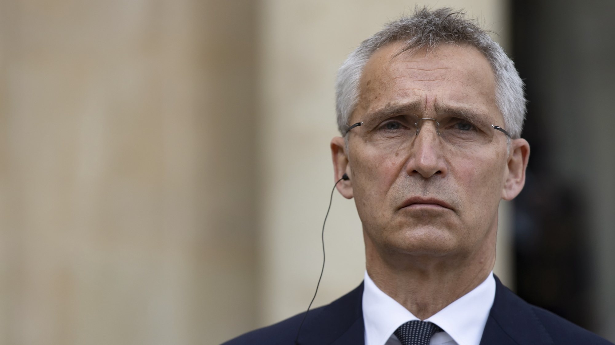 epa09217072 NATO Secretary General Jens Stoltenberg looks on during a joint statement with French President Macron after their meeting at the Elysee Palace in Paris, France, 21 May 2021. Both met to discuss preparations for the upcoming NATO Summit on 14 June 2021.  EPA/IAN LANGSDON