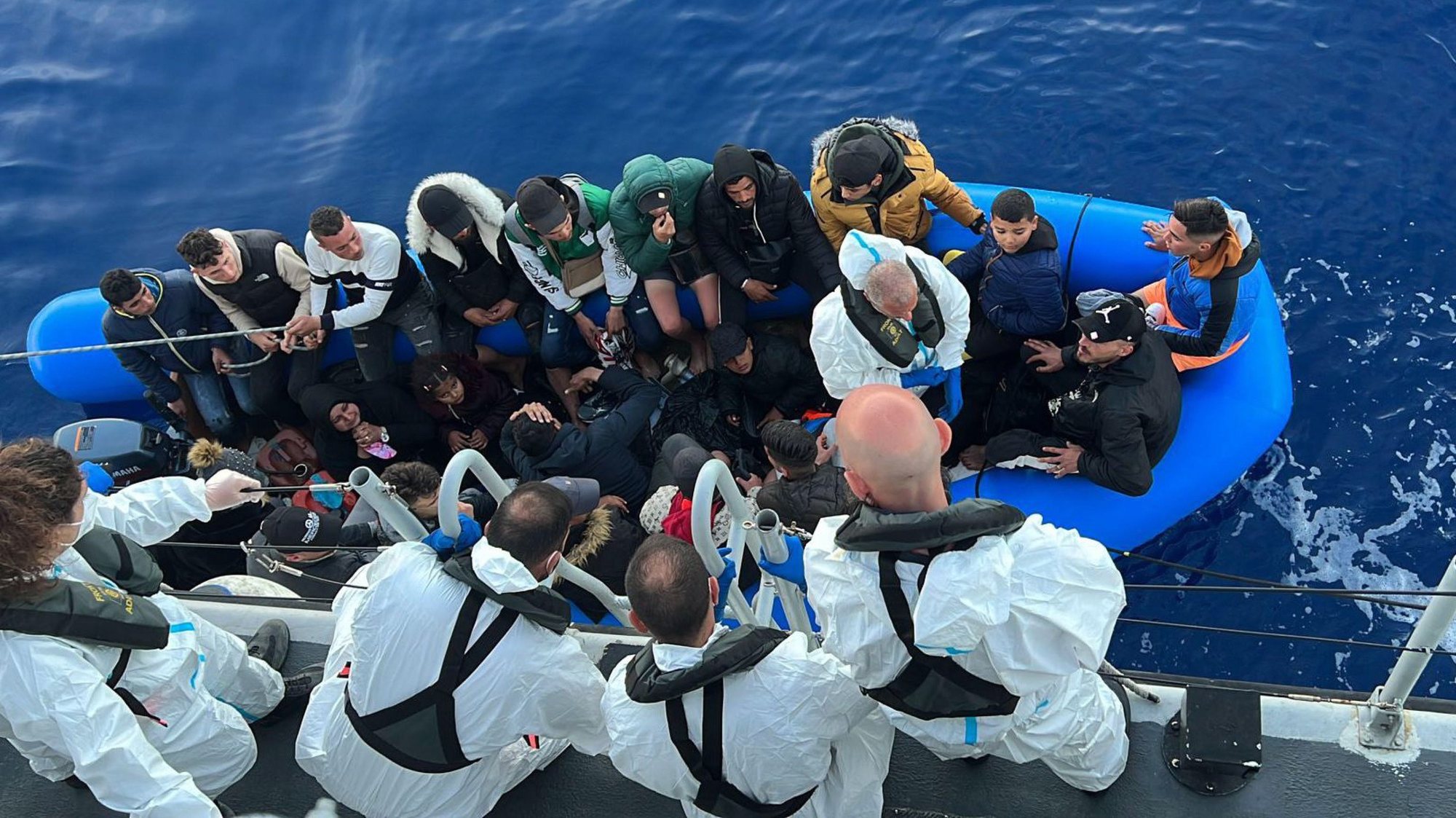 epa10611511 Migrants pictured after they were rescued in Lampedusa, Italy, 06 May 2023. More than 30 migrants, were rescued by the NGO ship Nadir and three fishing boats, and then transferred to the Coast Guard patrol boat.  EPA/Concetta Rizzo