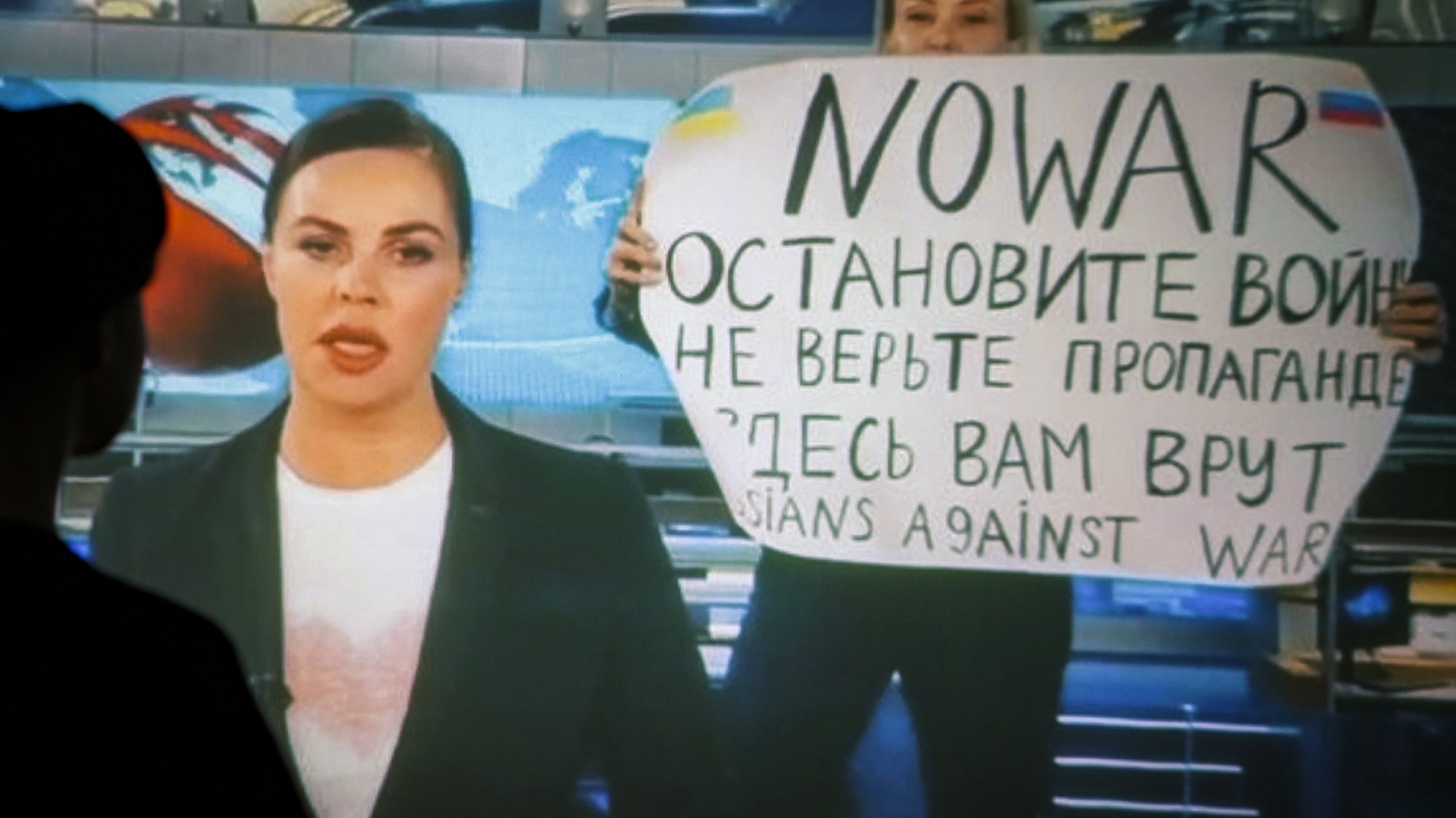 epaselect epa09826233 A woman watches a recorded feed of the Russian Channel One&#039;s evening news broadcast TV show in which an employee enters Ostankino on-air TV studio with a poster reading &#039;&#039;No War. Stop the war. Don&#039;t believe the propaganda. You are being lied to here&quot; in Moscow, Russia, 15 March 2022. The on-air protest was staged on 14 March by Marina Ovsyannikova, who worked as an editor. She was taken to the Ostankino police department. A protocol was drawn up against an employee of Channel One under the article on military censorship for discrediting the Russian armed forces. On 24 February Russian troops had entered Ukrainian territory in what the Russian president declared a &#039;special military operation&#039;, resulting in fighting and destruction in the country, a huge flow of refugees, and multiple sanctions against Russia.  EPA/DSK