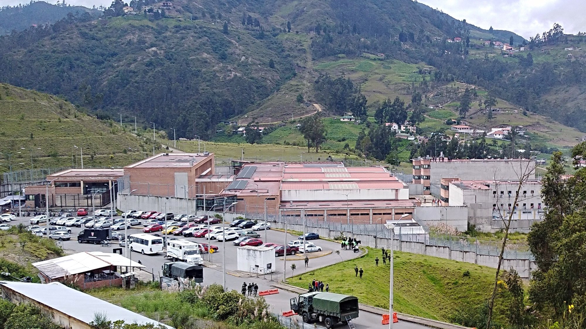 epa09032941 A handout photo made available by El Nuevo Tiempo Cuenca shows a general view of the Turi prison, in Cuenca, Ecuador, 23 February 2021. More than 60 inmates died this Tuesday in Ecuador in a chain of violent clashes in three prisons, attributed by the authorities to a dispute between two gangs for control of prisons. The latest official figures indicate 62 deaths, most of them in the Turi de Cuenca prison. There, 33 dead inmates were counted, while another 21 died in the Guayaquil prison and another 8 in the Cotopaxi prison, about 80 kilometers from Quito.  EPA/El Nuevo Tiempo Cuenca / HANDOUT MANDATORY CREDIT HANDOUT EDITORIAL USE ONLY/NO SALES