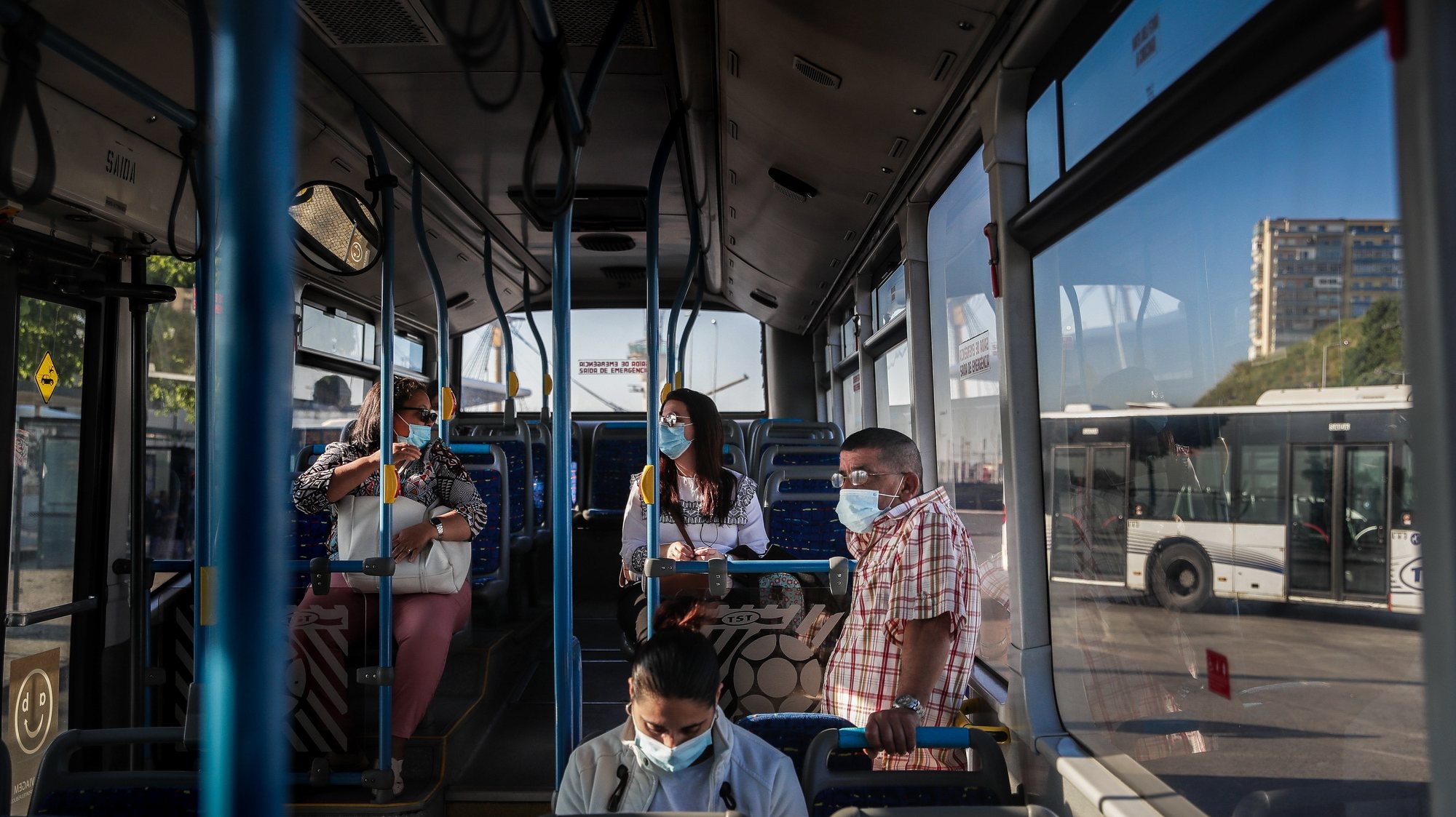 People inside a bus at Cacilhas Bus station, Almada, Portugal, 20 May 2020. Public transportation has been strengthened with the entry of the second phase of deconfinement due to the covid-19 pandemic, despite this, careers are still short, which contrasts with the large use of river transport by Transtejo/Soflusa. MARIO CRUZ/LUSA