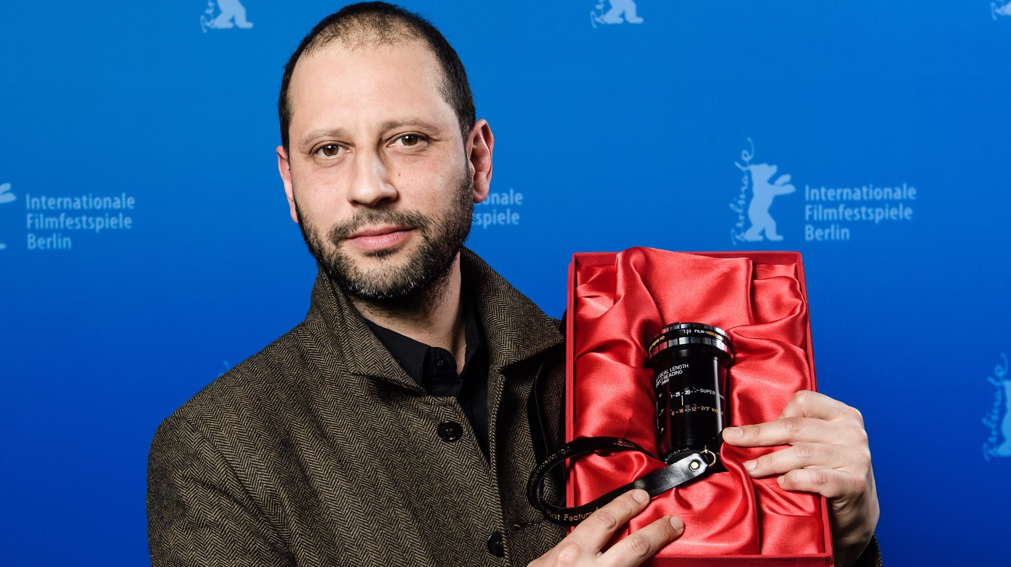 epa08260180 Camilo Restrepo poses with the GWFF First Feature Award for the movie &#039;Los Conductos&#039; during the Closing and Awards Ceremony of the 70th annual Berlin International Film Festival (Berlinale), in Berlin, Germany, 29 February 2020. The Berlinale runs from 20 February to 01 March 2020.  EPA/CLEMENS BILAN