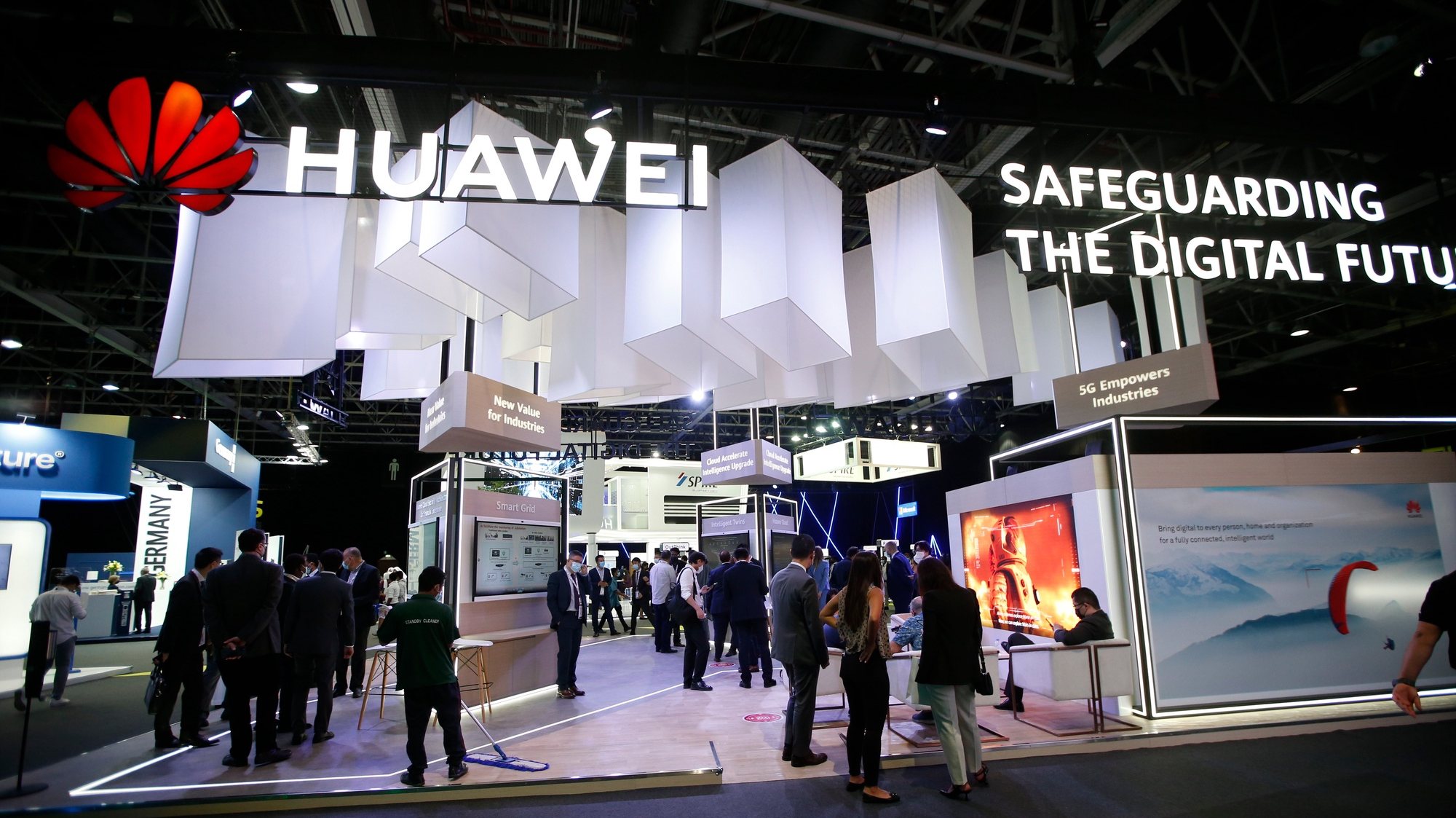 epa09238970 Visitors inspect Huawei section at the exhibition of the Gulf Information Security Expo &amp; Conference (GISEC) in the Gulf Emirate of Dubai, United Arab Emirates, 31 May 2021. The 8th edition of GISEC is running until 02 June 2021.  EPA/ALI HAIDER