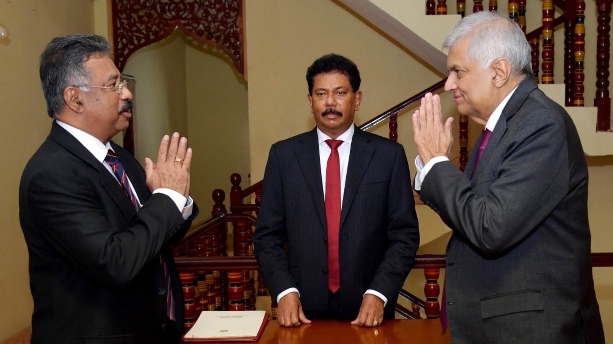 epa10072340 A handout photo made available by the Sri Lankan President&#039;s Media Division shows Sri Lankan Prime Minister Ranil Wickremesinghe (R) taking the oath as interim president of Sri Lanka before Chief Justice Jayantha Jayasuriya (L) in Colombo, Sri Lanka, 15 July 2022. Wickremesinghe was sworn in as the Parliament of Sri Lanka on 15 July accepted the resignation of President Gotabaya Rajapaksa, after he fled to Singapore through the Maldives following months of anti-government protests fueled by the ongoing economic crisis.  EPA/Sri Lankan President&#039;s Media Division HANDOUT  HANDOUT EDITORIAL USE ONLY/NO SALES
