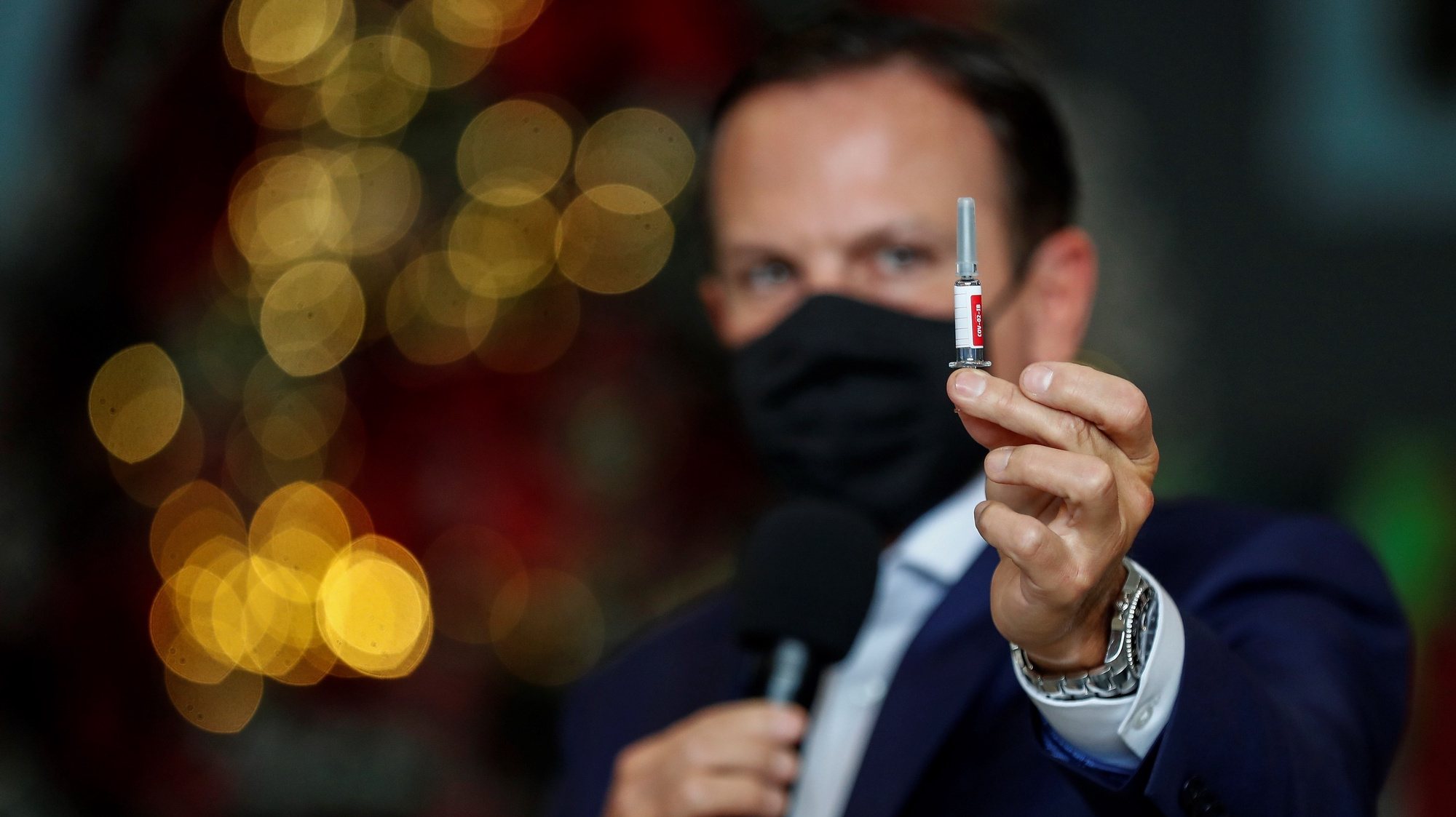 epa08868899 The Governor of Sao Paulo, Joao Doria, shows a vial of &#039;Coronavac&#039; during a press conference about his vaccination program against covid-19, in Sao Paulo, Brazil, 07 December 2020. Doria announced this Monday at the Palacio de los Bandeirantes, in Sao Paulo, that on 25 January 2021 the vaccination against covid-19 will begin in that state of Brazil, the most populous in the country, with some 46 million inhabitants and epicenter of the pandemic in the South American giant. As long as it gets the go-ahead from the Brazilian health regulator, health professionals, people over 75 years of age and the indigenous and quilombola population will be the first to receive the &#039;Coronavac&#039;.  EPA/Sebastiao Moreira