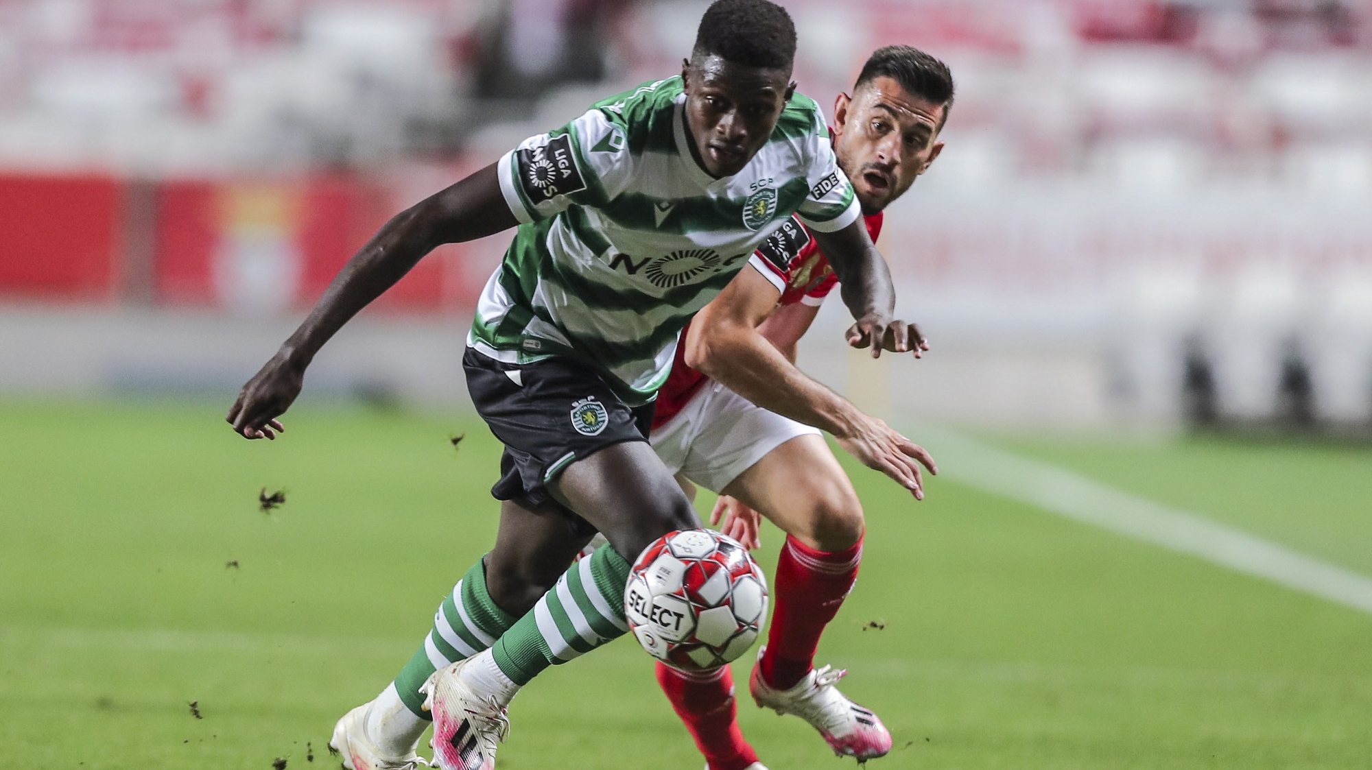Benfica&#039;s Pizzi (R) fight for the ball with Sporting&#039;s Nuno Mendes (L) during the Portuguese First League Soccer match held at Luz Stadium in Lisbon, Portugal 25 July 2020. MIGUEL A. LOPES/LUSA