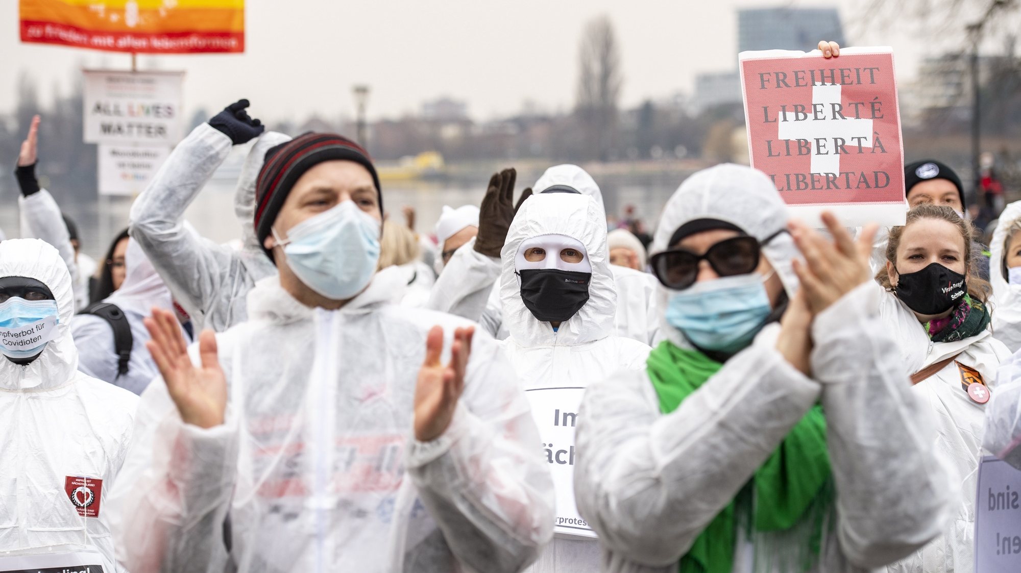 epa08991684 People demonstrate at a rally organized by the association &#039;Silent Protest&#039; against the restrictions and measures taken by the Swiss federal government during the Coronavirus Covid-19 pandemic,in Zug, Switzerland, 06 February 2021.  EPA/URS FLUEELER