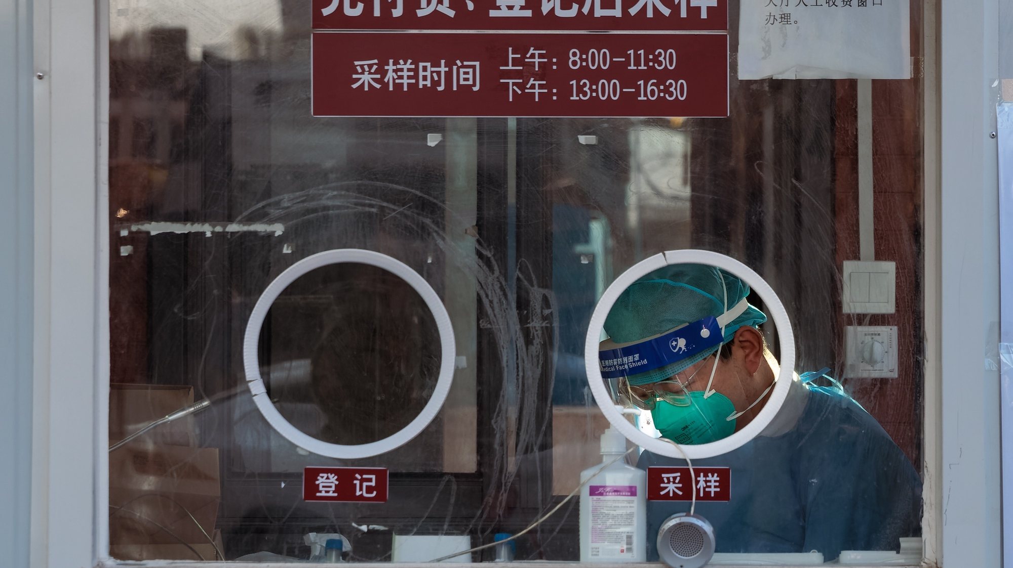epa10440822 A health worker sits inside a PCR testing booth in Shanghai, China, 31 January 2023. China’s health authorities reported on 30 January that the COVID-19 pandemic in the country was at a ‘low level’. According to the Chinese Center for Disease Control and Prevention, the current wave of infections is coming to an end.  EPA/ALEX PLAVEVSKI