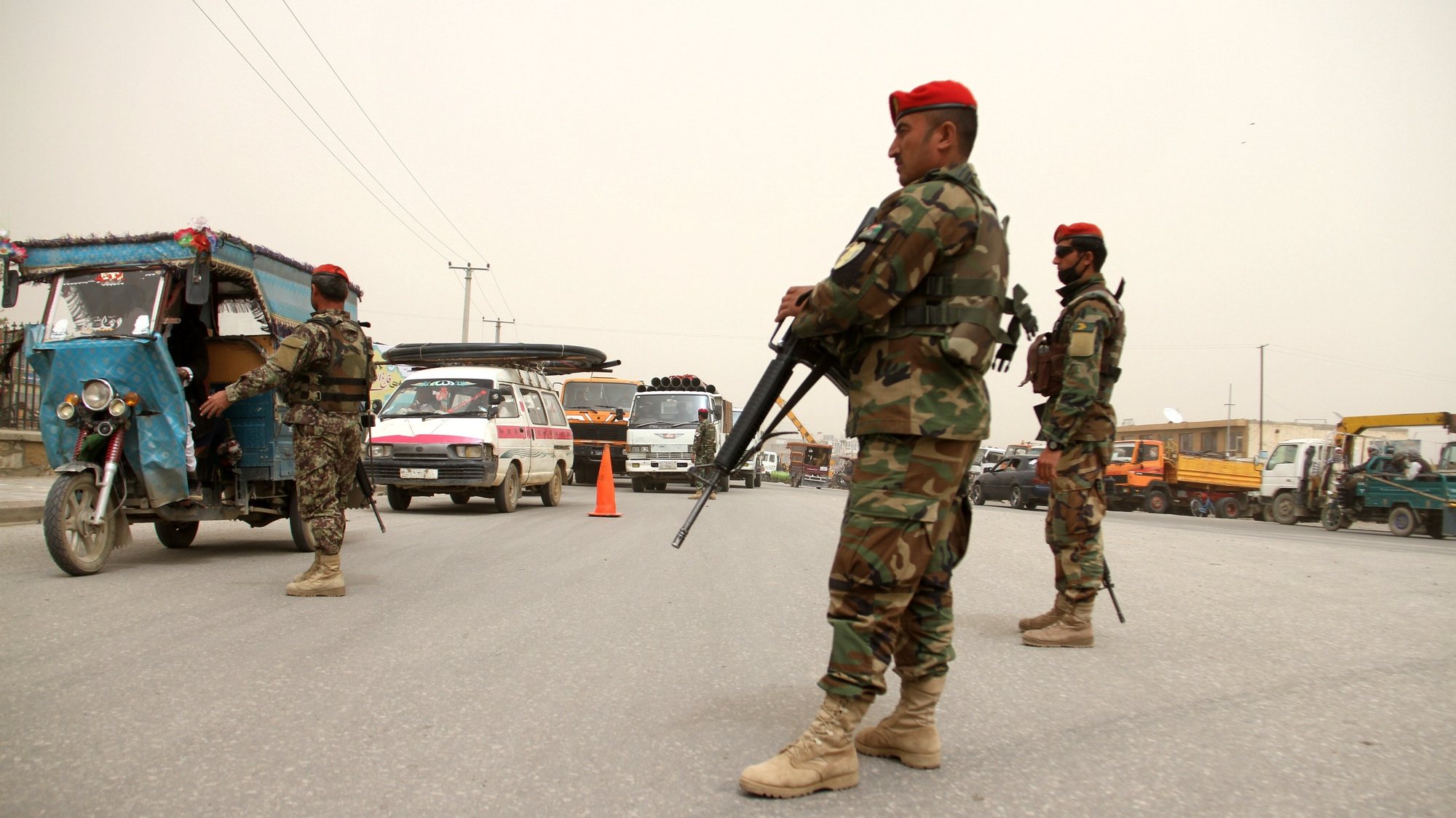 epa05921131 Afghan army soldiers stand guard on a roadside as security has been high intensified following a military base attack in Balkh province, in Ghazni, Afghanistan, 22 April 2017. According to latest media reports on 22 April 2017, at least 140 Afghan soldiers were killed when Taliban fighters attacked the army base in Mazar-i-Sharif on 21 April. The attack, perpetrated by as many as 10 fighters, occurred as the soldiers were leaving a mosque after Friday prayers and eating dinner at the base&#039;s canteen.  EPA/GHULAM MUSTAFA
