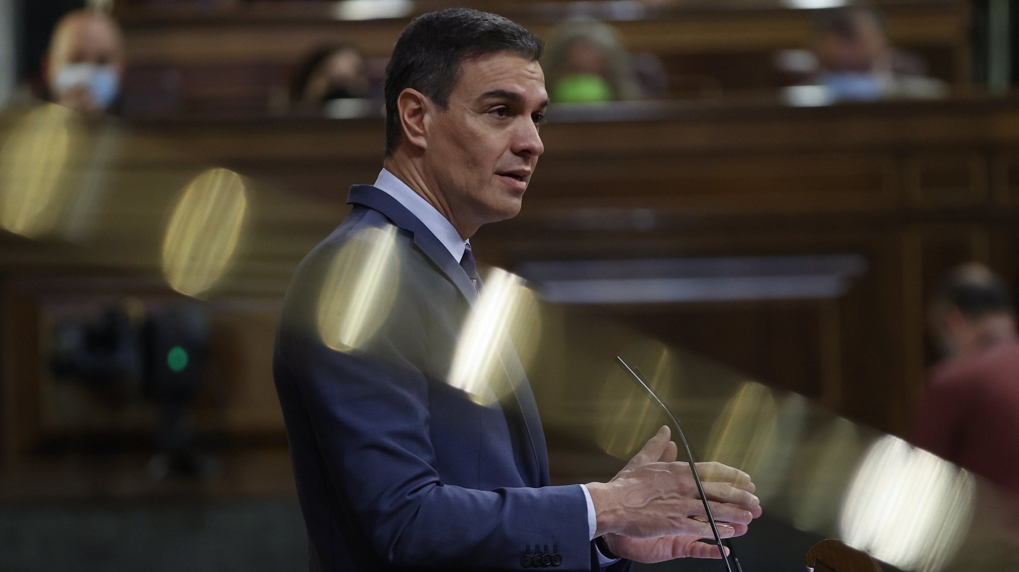 epa09860046 Spanish Prime Minister Pedro Sanchez delivers a speech to explain the conclusions reached in latest European Council, NATO summit and situation with Morocco during the weekly Spanish Government&#039;s question time session at Congress of Deputies, in Madrid, Spain, 30 March 2022.  EPA/Chema Moya