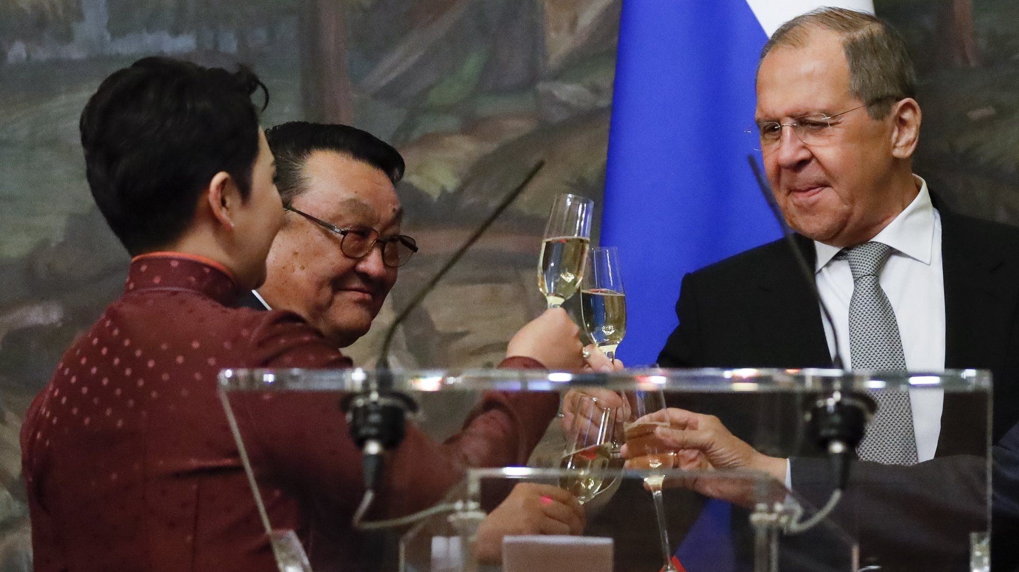 epa09240928 Russian Foreign Minister Sergey Lavrov (R)  toasts with Mongolian cosmonaut Jugderdemidiin Gurragchaa (C) and Mongolian Foreign Minister Battsetseg Batmunkh (L) after awarding ceremony in Moscow, Russia, 01 June 2021. Mongolian Foreign Minister is on a working visit to Russia.  EPA/ALEXANDER ZEMLIANICHENKO/POOL