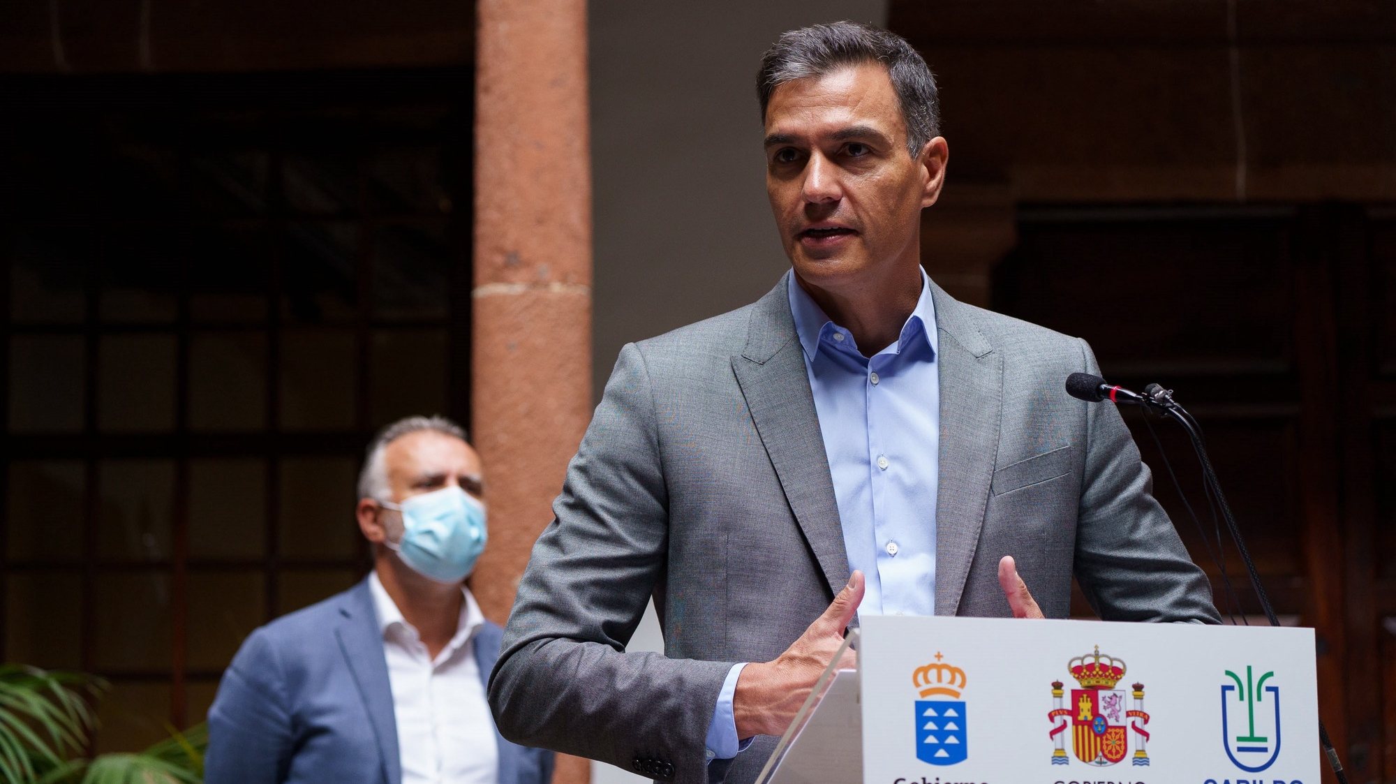 epa09485385 Spanish Prime minister Pedro Sanchez (R) and Canary Islands regional president Angel Victor Torres (L) during the press conference after their work meeting held at Santa Cruz de La Palma, Canary Islands, Spain on 24 September 2021 to evaluate the damages caused by the Cumbre Vieja volcano. The volcano began to erupt in Rajada Mountain in the municipality of El Paso on 19 September. The area had registered hundreds of small earthquakes along the week as magma pressed the subsoil on its way out, urging the regional authorities to evacuate locals before the eruption took place.  EPA/Ramon de la Rocha