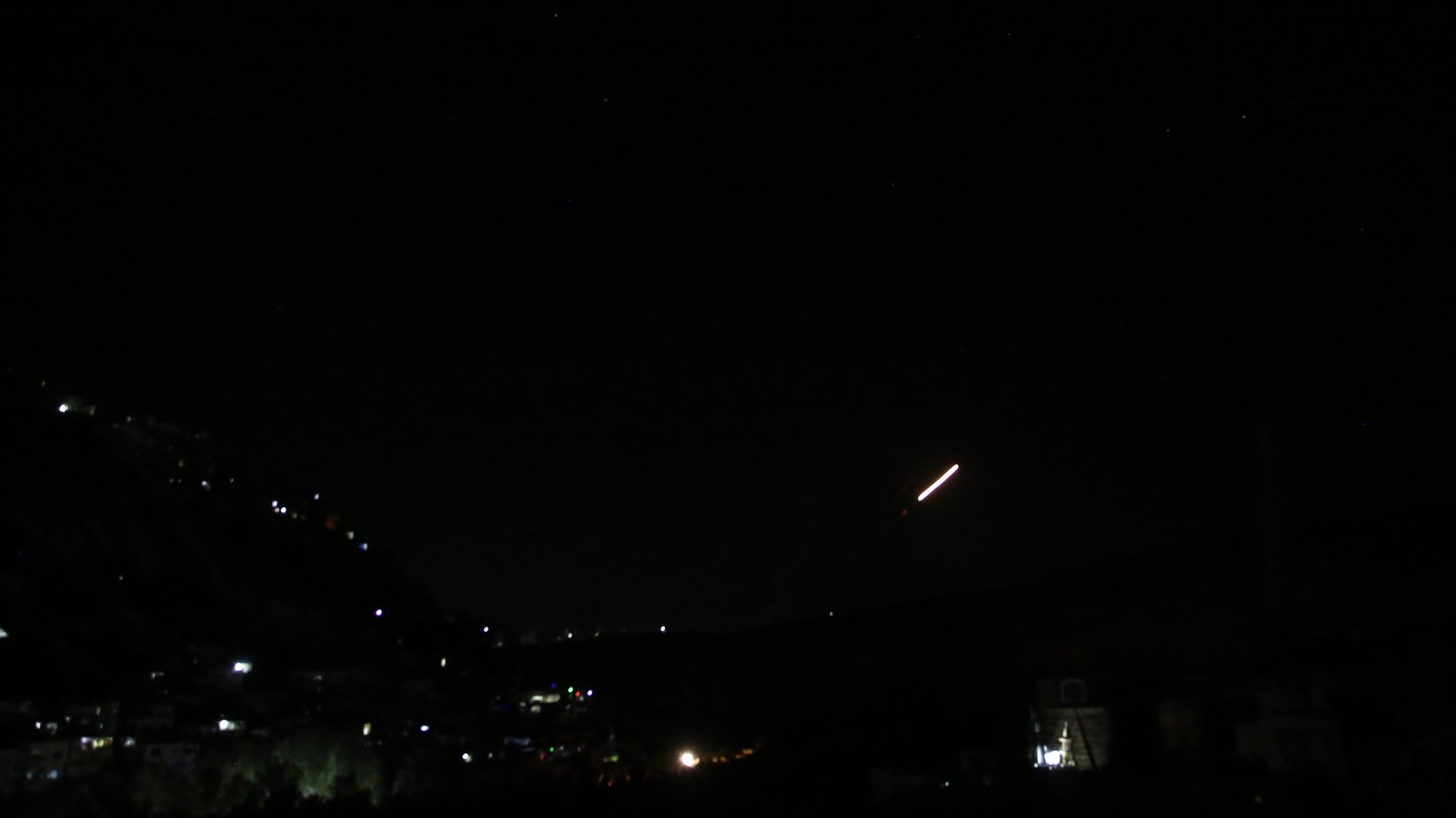 epa09444317 Syrian air defenses intercept projectiles allegedly launched from Israel, in the countryside near Damascus, Syria, 02 September 2021. According to SANA, the air defences downed a number of missiles in the skies above Damascus.  EPA/YOUSSEF BADAWI