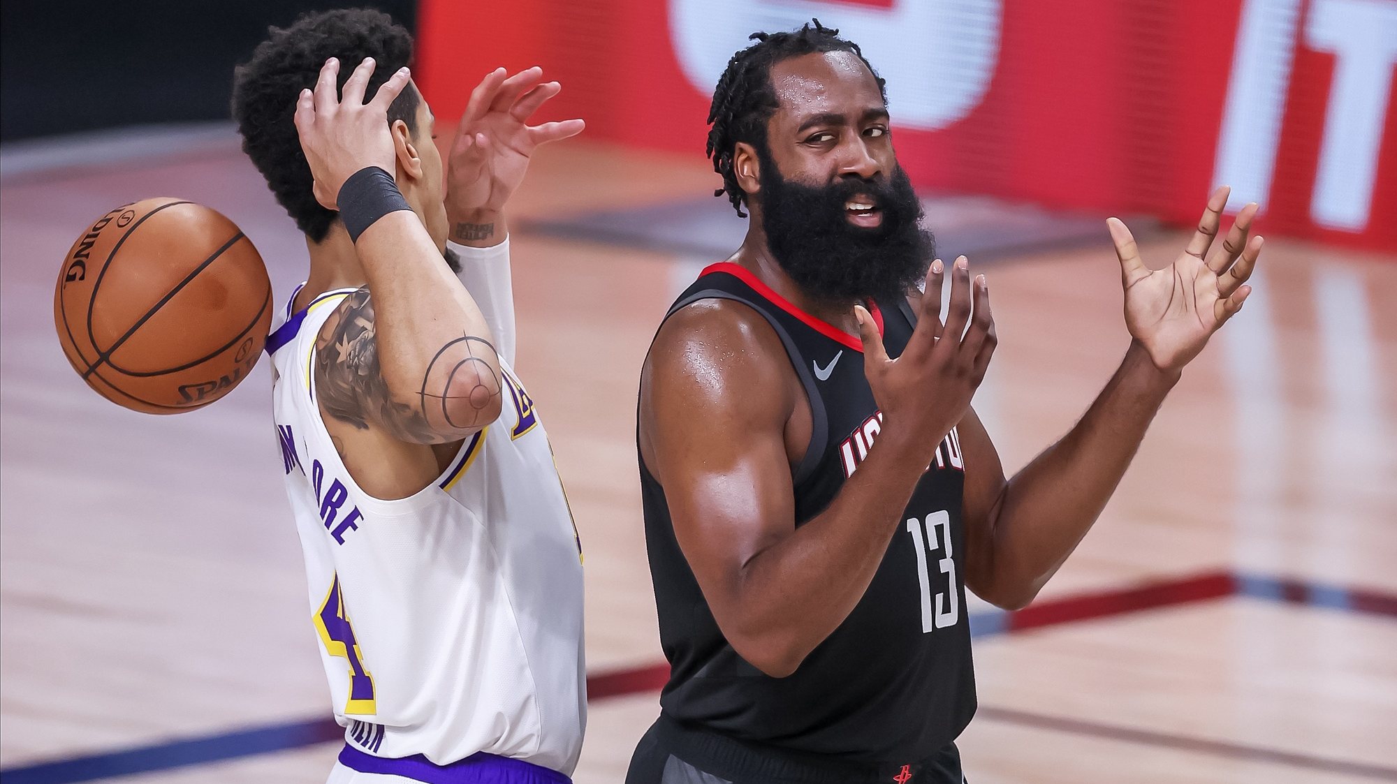 epa08665556 Houston Rockets guard James Harden (R) reacts to having an offensive foul called against him as Los Angeles Lakers guard Danny Green (L) looks on during the second half of the NBA basketball semifinal Western Conference playoff game five between the Houston Rockets and the Los Angeles Lakers at the ESPN Wide World of Sports Complex in Kissimmee, Florida, USA, 12 September 2020.  EPA/ERIK S. LESSER  SHUTTERSTOCK OUT