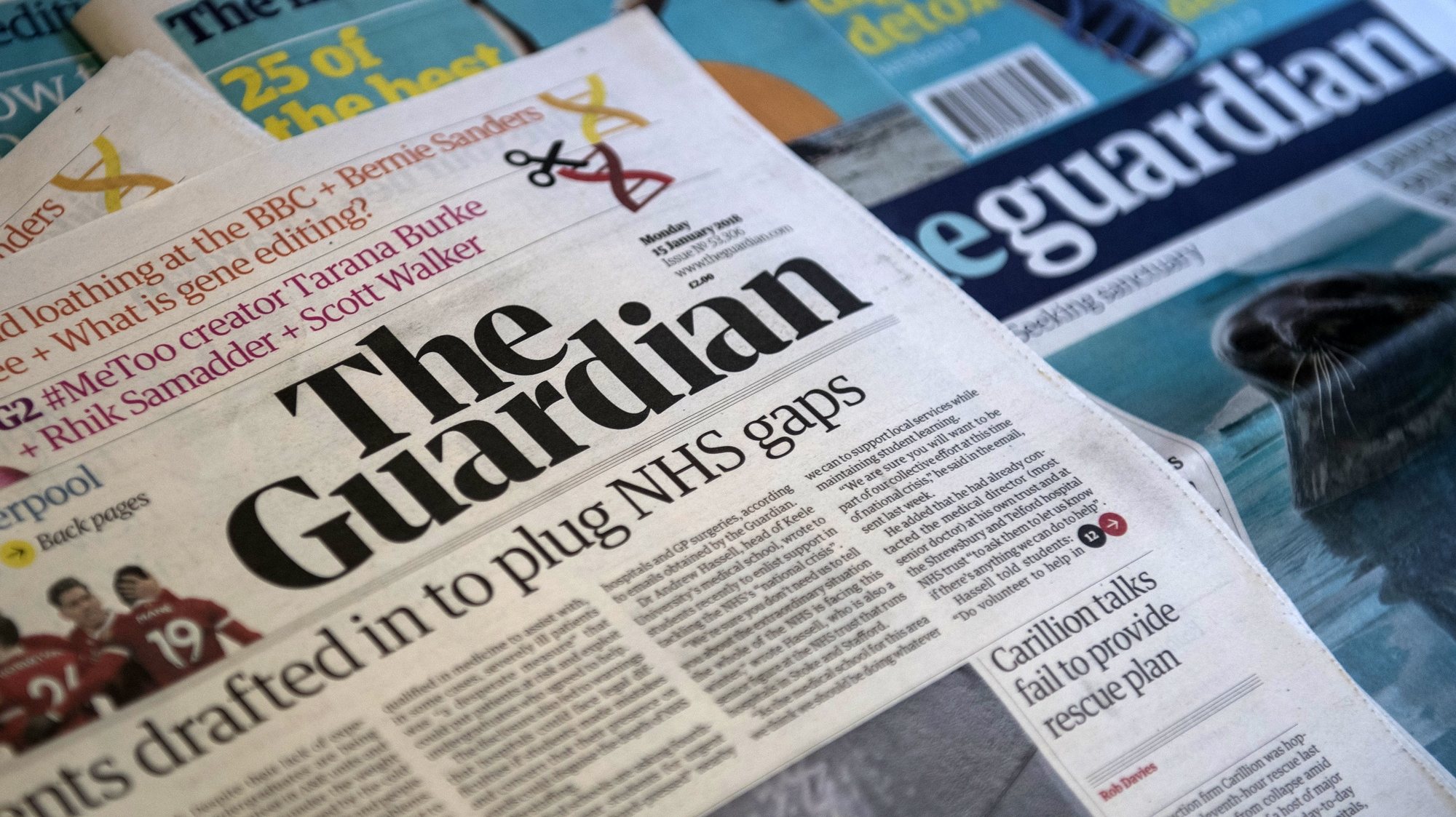 epa06440618 A photographer showing the new look Guardian newspaper in Central London, Britain, 15 January 2017. The Guardian newspaper has unveiled a new look tabloid design and format to replace its Berliner format in an attempt to save costs.  EPA/WILL OLIVER