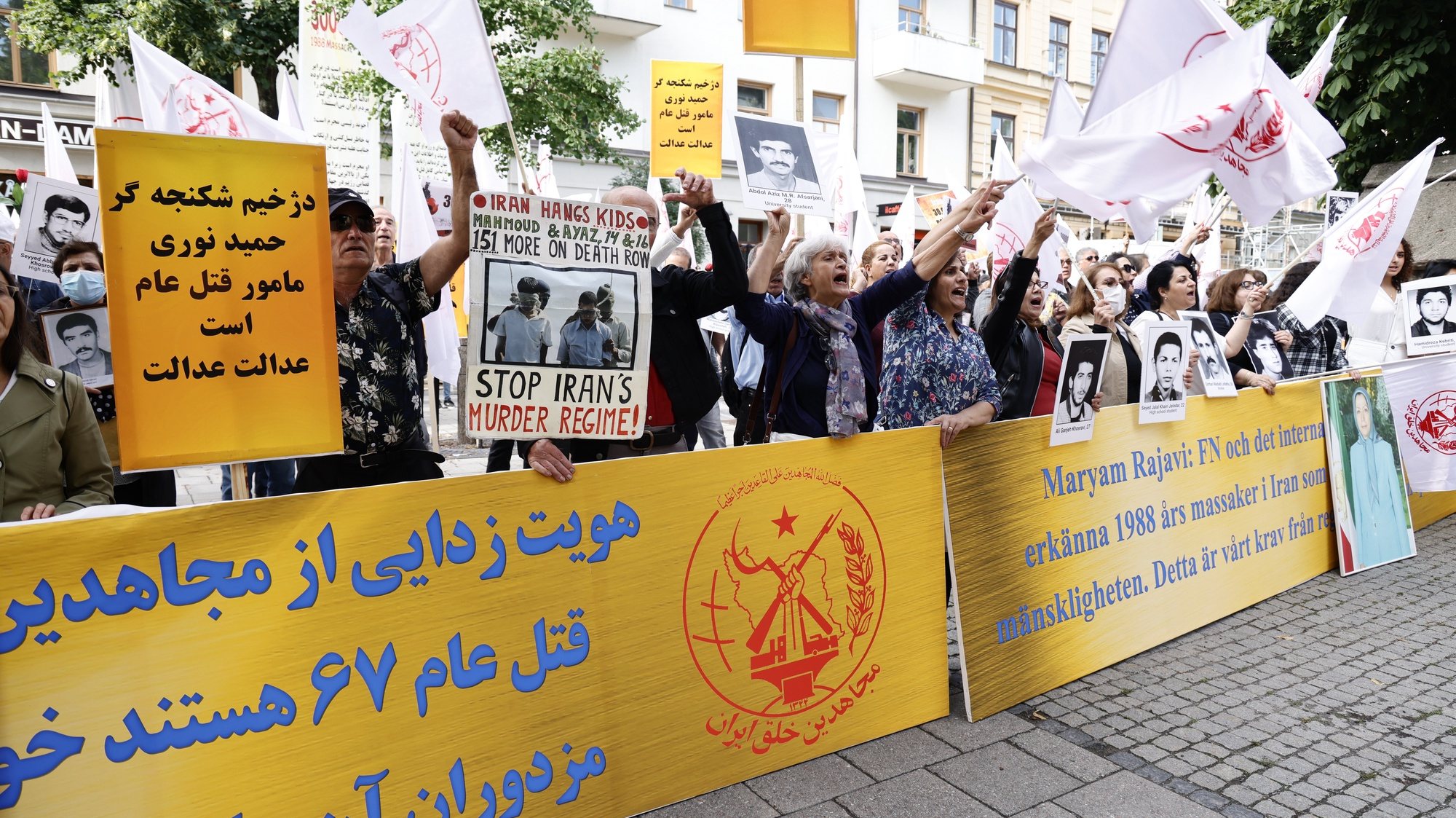 epa09407908 Supporters of the People&#039;s Mojahedin Organization of Iran protestoutside Stockholm distric court as the trial of Hamid Noury starts in Stockholm, Sweden, 10 August 2021. This is the first day of the trial of Hamid Noury who is accused of involvement in the massacre of political prisoners in Iran in 1988.  EPA/STEFAN JERREVANG SWEDEN OUT