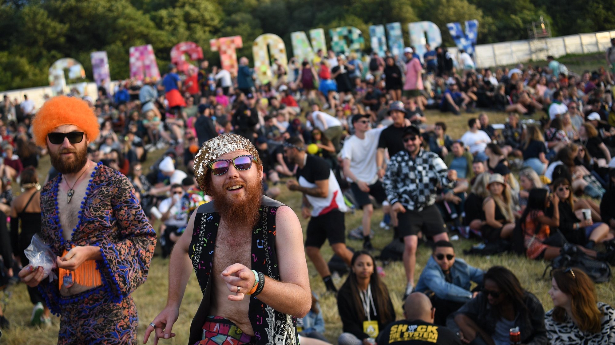 epa08303237 (FILE) - Festival goers dance on the first day of the Glastonbury Festival at Worthy Farm in Somerset, Britain, 26 June 2019 (reissued 18 March 2020). According to media reports, the Glastonbury festival has been cancelled due to the coronavirus pandemic. It was due to celebrate its 50th anniversary.  EPA/NEIL HALL *** Local Caption *** 55300911