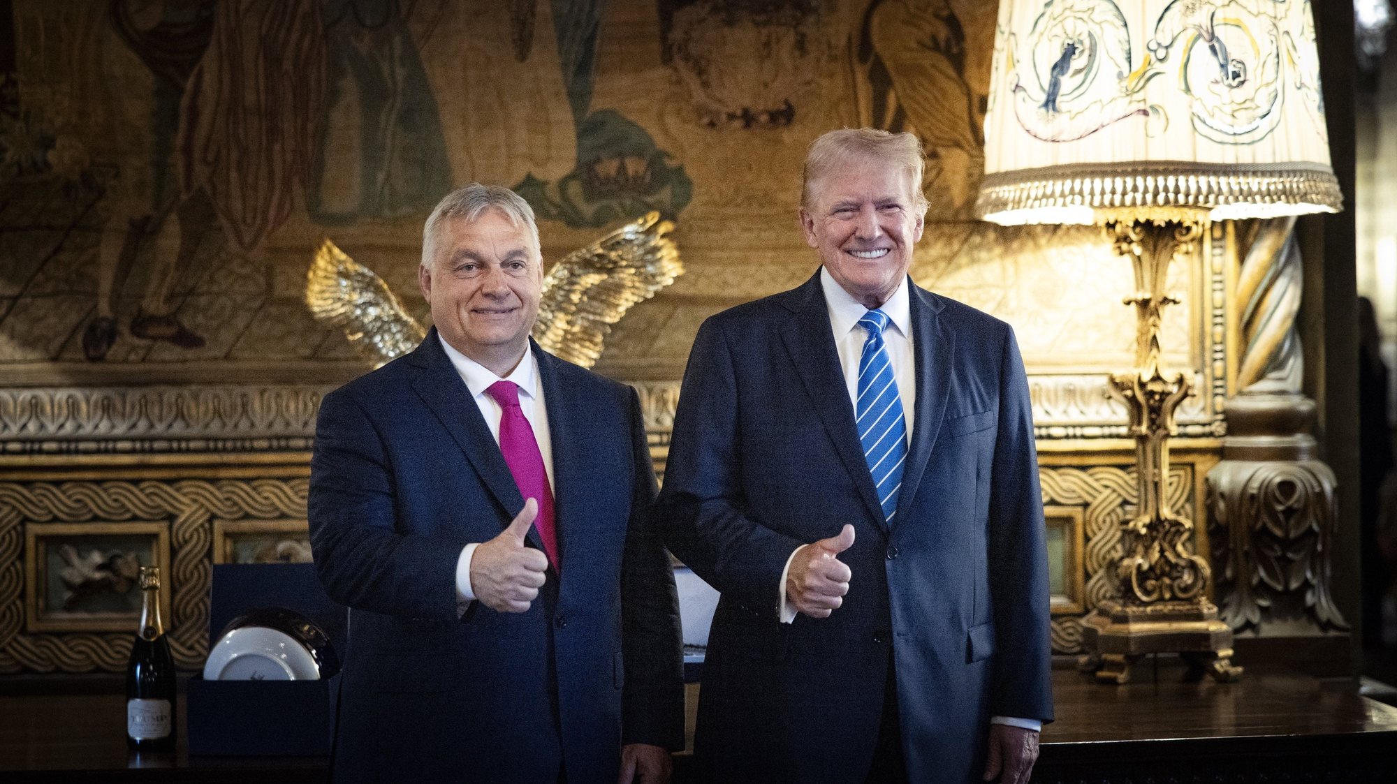 epa11473669 A handout photo made available bythe Hungarian PM’s Press Office shows Hungarian Prime Minister Viktor Orban (L) and former US president and Republican presidential candidate Donald Trump (R) posing for photographs during their meeting in Trump&#039;s Mar-a-Lago estate in Palm Beach, Florida, USA, 11 July 2024.  EPA/Zoltan Fischer HANDOUT HUNGARY OUTHANDOUT EDITORIAL USE ONLY/NO SALES