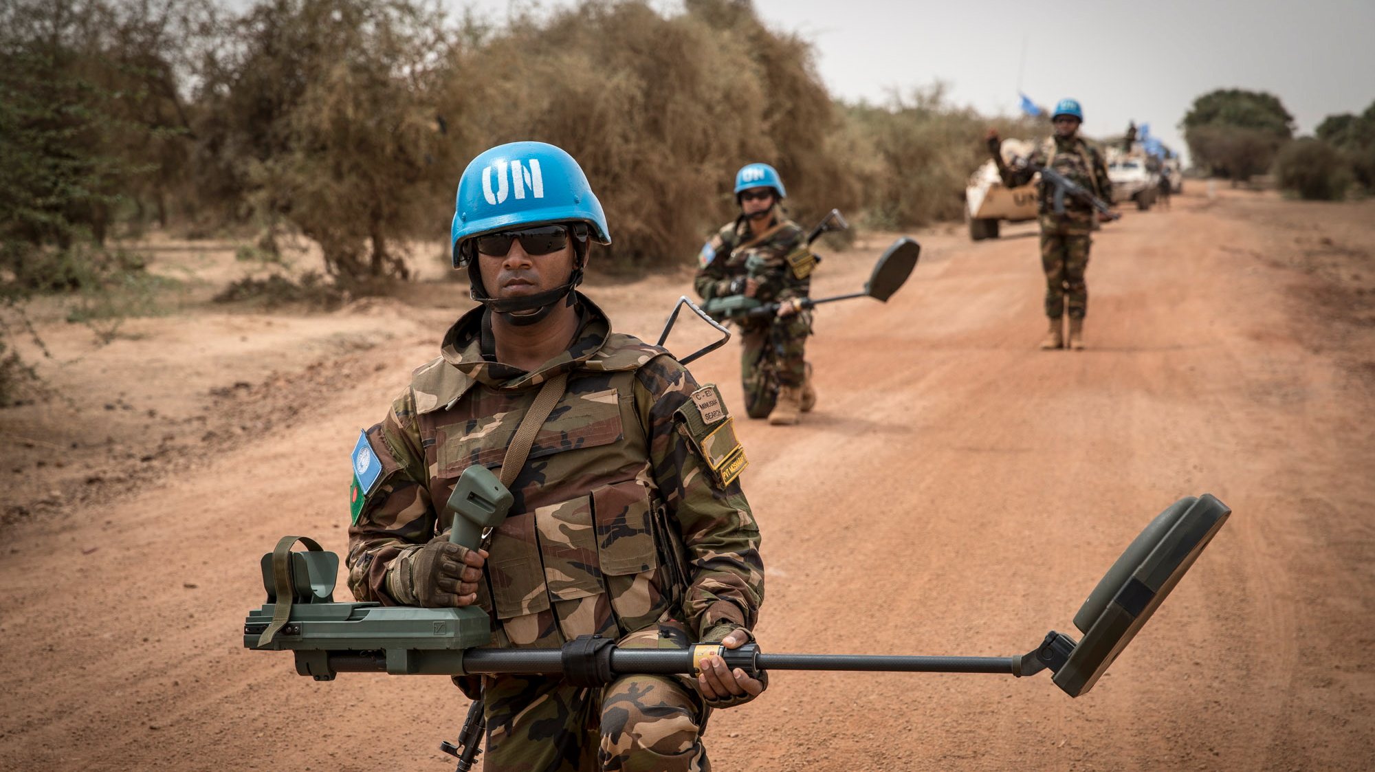 epa07519672 A handout photo made available by MINUSMA, a United Nations peacekeeping force in Mali, showing UN peacekeeping soldiers with mine-detecting devices walking ahead of a convoy with armoured vehicles on patrol at a undisclosed location in Mali, 27 March 2019. Reports on 21 April 2019 state one UN peacekeeper was killed and four others wounded in an attack 20 April against MINUSMA forces in Mali&#039;s Mopti region. MINUSMA said in a statement that a UN convoy was attacked by using an improvised explosive device, also called IED. UN confirmed those dead and injured were from Egypt. One attacker was reportedly killed while eight others were taken prisoners.  EPA/MINUSMA HANDOUT  HANDOUT EDITORIAL USE ONLY/NO SALES