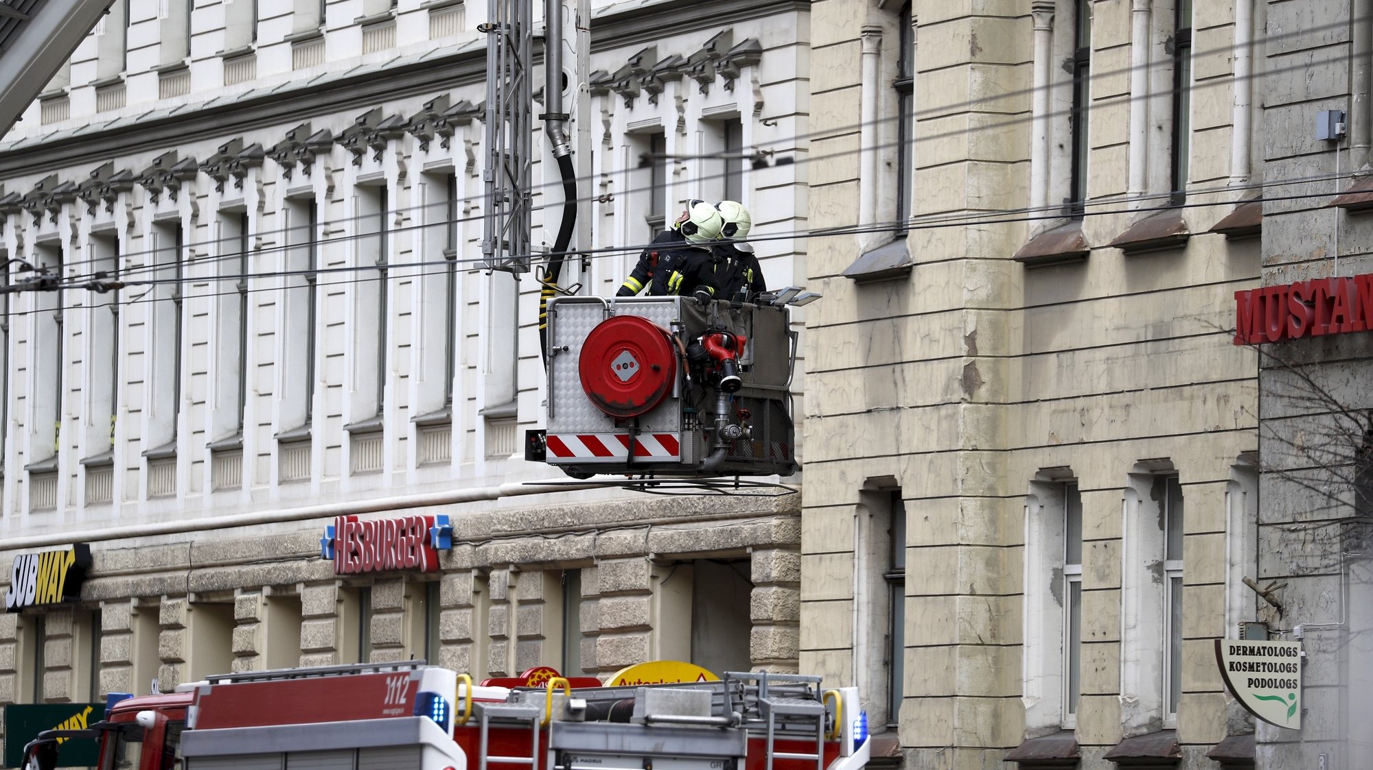 epa09164800 Firefighters inspect the building after a fire in the hostel in the center of Riga, Latvia, 28 April 2021. Eight people died, nine injured and 24 evacuated after a fire erupted in Japanese Style Centrum hostel. Mayor of Riga Martins Stakis described the hostel as &#039;illegal&#039; while police had launched a criminal investigation.  EPA/TOMS KALNINS