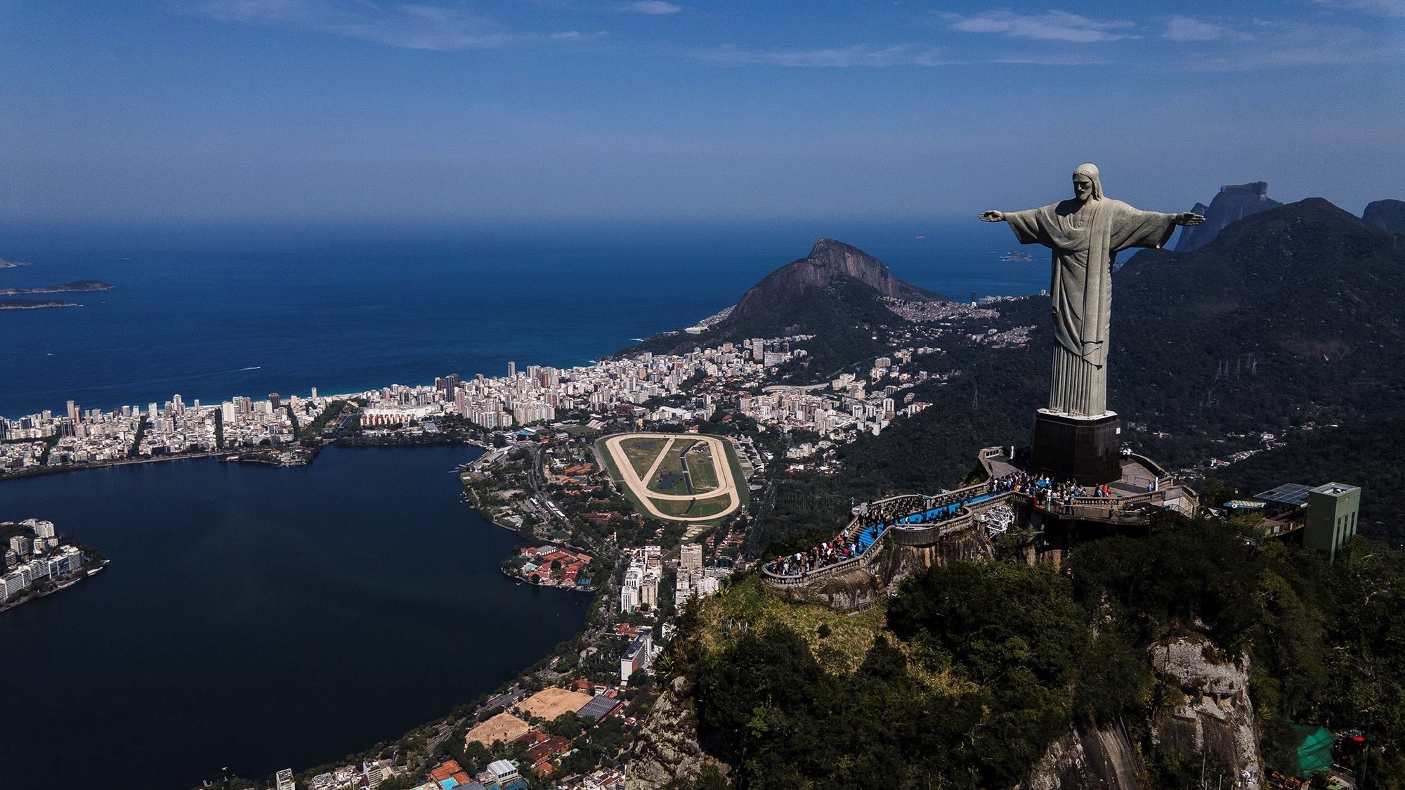 epa08605961 An aerial view of the Christ the Redeemer during its reopening to tourism, in Rio de Janeiro, Brazil, 15 August 2020. Rio de Janeiro has reopened touristic hotspots as the Sugarloaf Mountain, the aquarium, and the giant waterwheel despite warnings for the increase of coronavirus spread in the city.  EPA/Antonio Lacerda