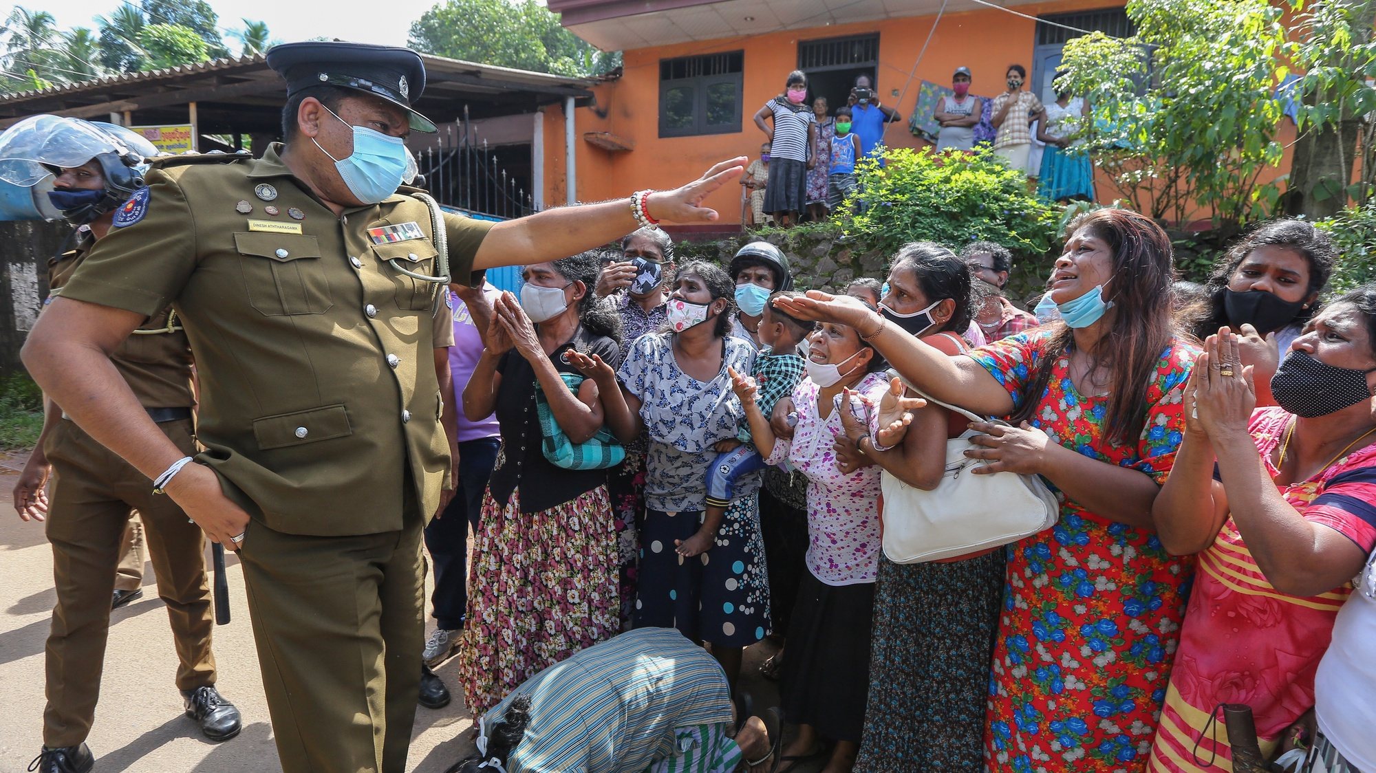 epaselect epa08852418 Relatives of prison inmates plead to authorities to save their kin in the Mahara Prison Complex in the suburbs of Colombo, Sri Lanka, 30 November 2020. A riot by inmates broke out on 29 November at the sprawling at the Mahara maximum security prison, one of the largest prisons in Sri Lanka. By the morning of 30 November, prison authorities confirmed that eight inmates were killed when prison and police officials opened fire at rioters while over 40 others were injured and admitted to the hospital. Presently, according to theÂ Commissioner-General of Prisons, the fire that broke out in some of the buildings has been extinguished and the situation almost brought under control.Â According to local media reports, 183 inmates of Mahara prison tested positive for COVID-19, increasing the number of COVID-19 infections at Sri Lanka&#039;s prisons by 1,091.  EPA/CHAMILA KARUNARATHNE