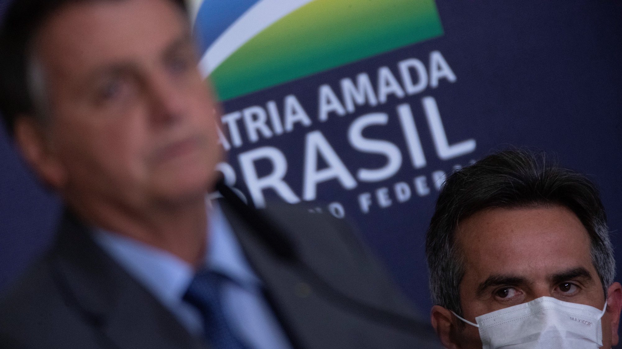 epa09371932 Senator Ciro Nogueira (R), along with the President of Brazil Jair Bolsonaro, participates in an act at the Palacio do Planalto, in Brasilia, Brazil, 27 July 2021. Bolsonaro took the first step of a new ministerial reform to cement his support in Congress and gives momentum to his controversial agenda, at a time of strong resistance due to the health and economic crisis caused by the coronavirus pandemic.  EPA/Joedson Alves