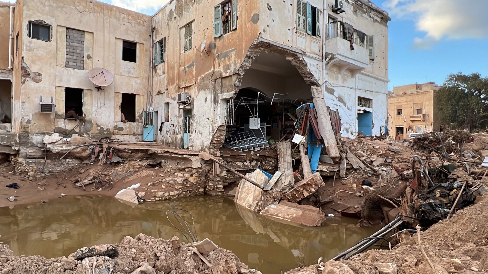 epa10868434 A damaged building, days after Storm Daniel swept across eastern Libya, in the port city of Derna, Libya, 18 September 2023. Intense rainfall from the storm in the country&#039;s eastern region caused the collapse of two dams south of the city of Derna, sweeping away entire neighborhoods. The death toll has surpassed 11,300 and over 34,000 people have been displaced across the country. The flooding exacerbated Libya&#039;s needs, where 800,000 people are reported in need of humanitarian assistance, the International Rescue Committee (IRC) said.  EPA/STR