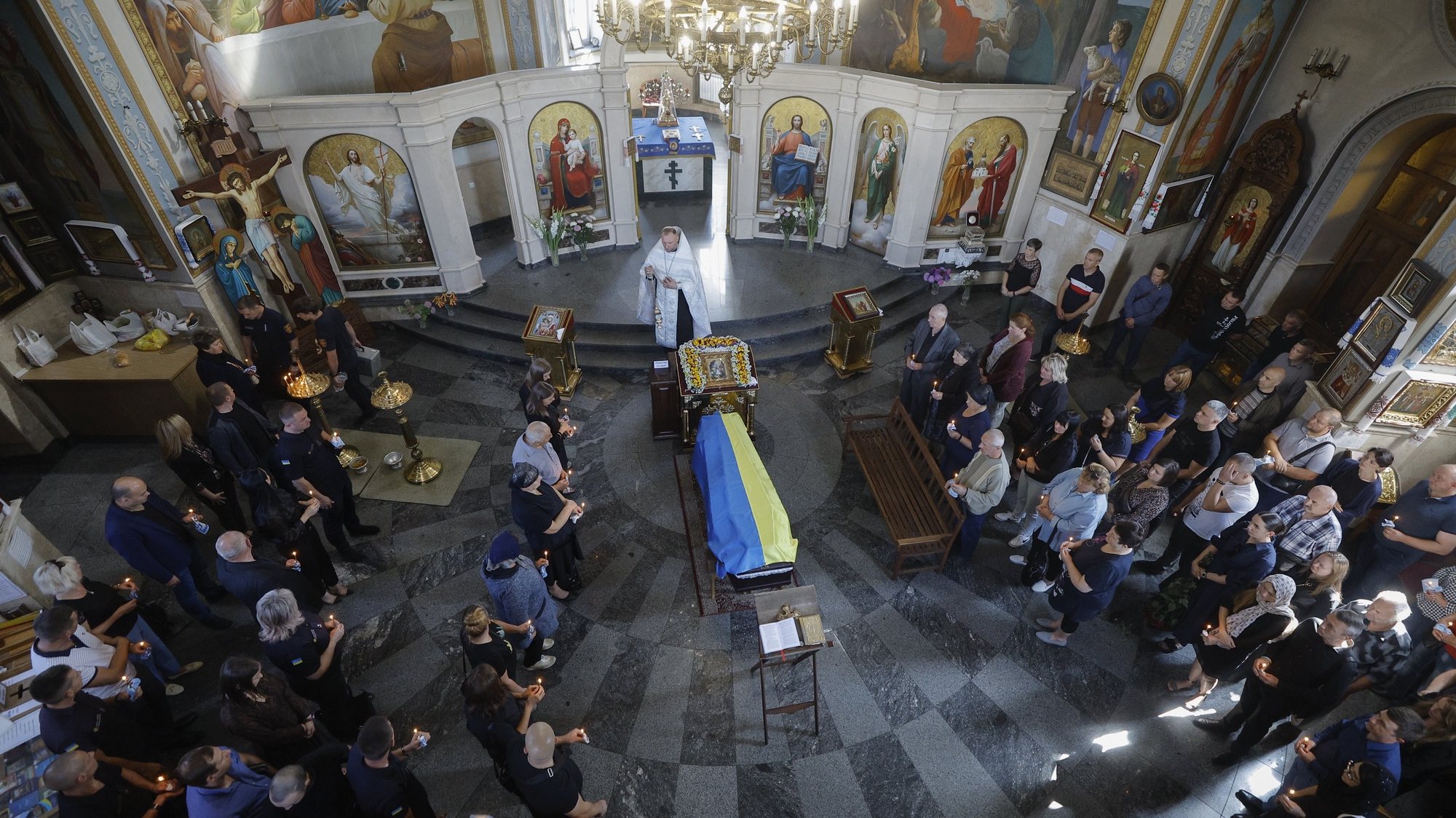 epa10848410 Relatives, friends and comrades of late Ukrainian rescue unit member Ruslan Koshovyi attend his funeral in Kyiv, Ukraine, 08 September 2023. Koshovyi died on 24 February 2022, the first day of the Russian invasion of Ukraine, while trying to save his subordinates and equipment at the Hostomel airfield near Kyiv. The Kremlin troops did not initially allow for Koshovyi’s body to be collected. After the Russians had left Hostomel, his human remains were not immediately found. Only now, over 18 months after his death, was there an opportunity to have a proper funeral.  EPA/SERGEY DOLZHENKO 27479