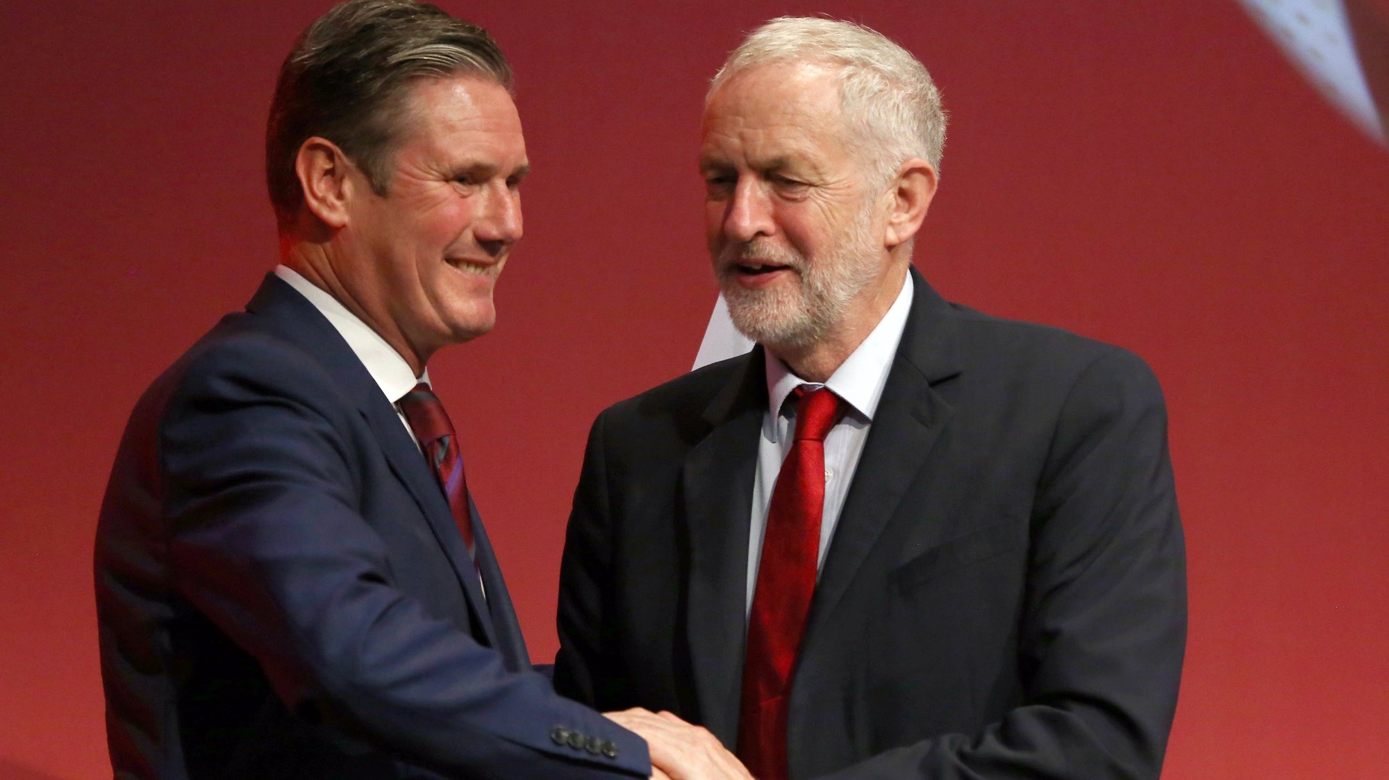 epa08342489 (FILE) - Britain&#039;s opposition Labour Party then Spokesperson for Exiting the EU, Keir Starmer (L) is congratulated following his speech by then party leader Jeremy Corbyn (R) at the Labour Party Conference in Brighton, Britain, 25 September 2017 (reissued 04 April 2020). Keir Starmer was announced elected succesor to Labour Party leader Jeremy Corbyn on 04 April 2020 in a ballot of party members, trade unionists and other supporters.  EPA/NEIL HALL *** Local Caption *** 53790919