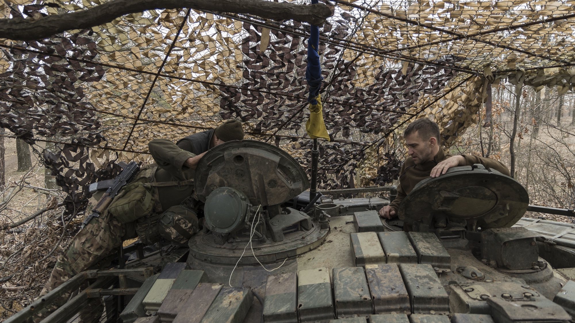 epa11225224 Servicemen of the 24th Mechanized Brigade of the Ukrainian Ground Forces inside a concealed tank at their position at a frontline in the Donetsk area, Ukraine, 16 March 2024 (issued 17 March 2024). Russian troops entered Ukraine in February 2022 starting a conflict that has provoked destruction and a humanitarian crisis.  EPA/YAKIV LIASHENKO