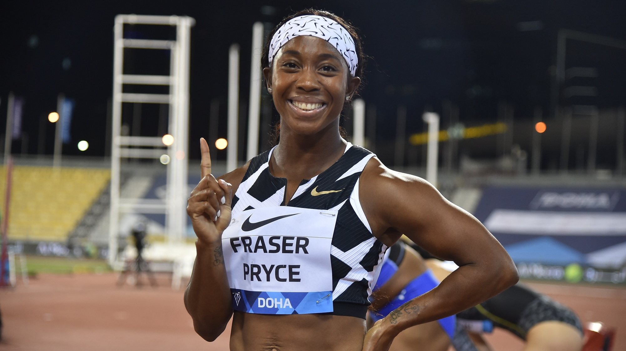epa09234301 Shelly-Ann Fraser-Pryce of Jamaica celebrates after the 100m Women final race at the Doha Diamond League athletics meeting at Qatar Sports Club in Doha, Qatar, 28 May 2021.  EPA/Noushad Thekkayil