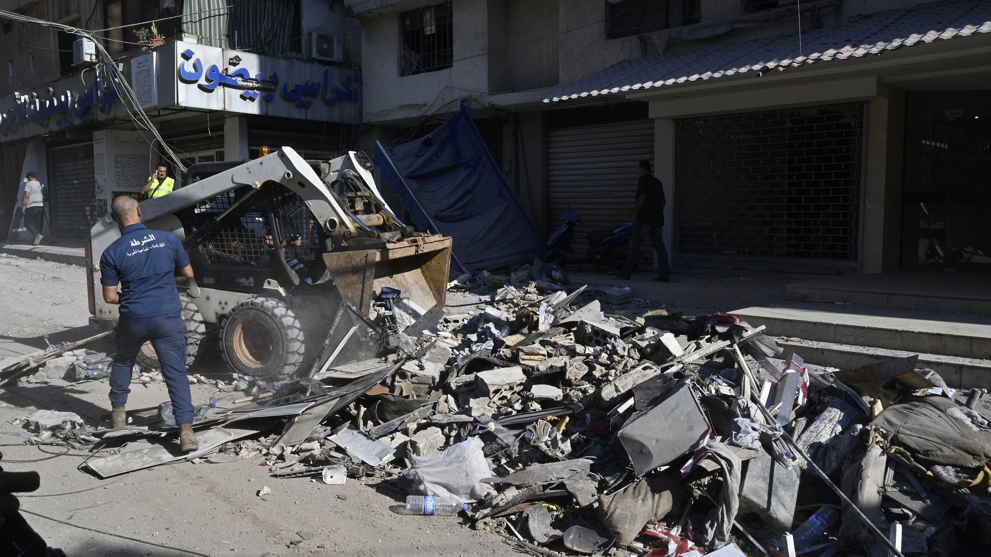 epa11510825 Municipal workers remove debris at the site of an Israeli strike the previous day in Beirut, Lebanon, 31 July 2024. Lebanon&#039;s state media said an Israeli drone targeted an area in the Haret Hreik neighborhood of Beirut. Israel Defense Forces (IDF) announced to have killed Hezbollah&#039;s senior military commander Fuad Shukr in a &#039;targeted strike&#039; in Beirut on 30 July.  EPA/WAEL HAMZEH