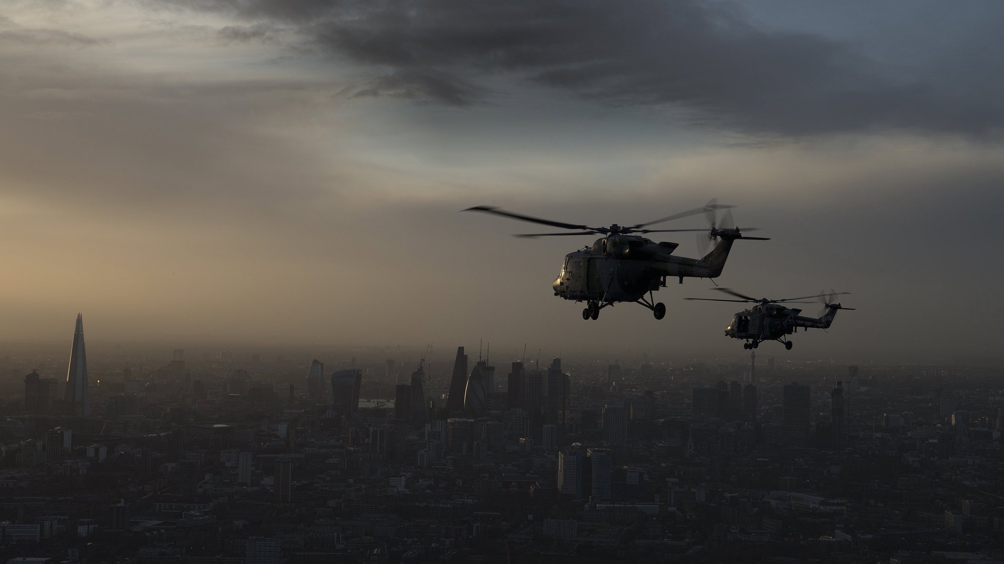 epa06444090 A handout photo made available by th British Ministry of Defence (MOD) showing two British Army Lynx helicopters on their last flight flying at sunset over London, Britain, 16 January 2018. The MOD stated that the Army paid special tribute as one of its most ubiquitous aviation assets bows out of service. The Lynx helicopter has had a long and distinguished career with the British Army stretching back nearly 40 years. Described as a primary battlefield utility helicopter, the venerable Lynx entered service back in 1978 and since then has been used to: destroy tanks, evacuate the wounded, gather intelligence, provide humanitarian support, rescue those in peril, and much more besides. It’s seen service across the globe from the freezing plains of Northern Canada to the dust bowls of the Middle East and has supported British troops on active service in Bosnia, Kuwait and Afghanistan.However, age has finally caught up with the Lynx and although it’ll be a tough act to follow, Wildcat will replace the Lynx. With its superior avionics uprated engines and improved capability it too will prove a formidable force over any battlefield of the future. To mark the Lynx’s decommissioning from British Army service, the Army Air Corps flew five of the last remaining airframes from RAF Odiham in Hampshire, where they are based, on a commemorative tour around England taking in some of the sites and locations to which the aircraft is most fondly associated: Middle Wallop, Upavon, Yeovil, Wattisham to name a few. The flight culminated in an impressive V5 ‘air procession’ along the length of the River Thames over Central London.  EPA/Corporal Mark Larner / BRITISH MINISTRY OF DEFENCE /  HANDOUT MANDATORY CREDIT: Corporal Mark Larner (MOD): CROWN COPYRIGHT HANDOUT EDITORIAL USE ONLY/NO SALES