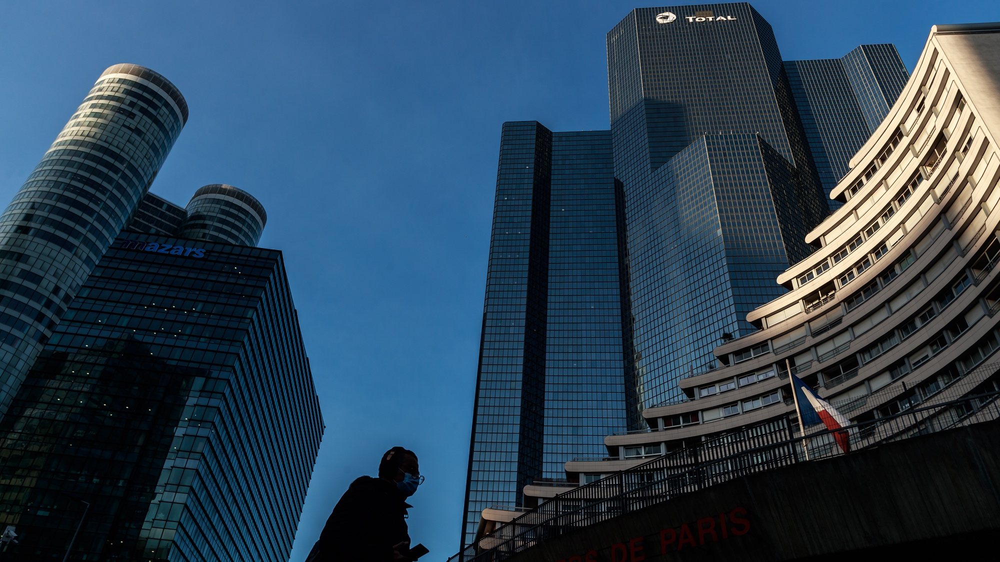 epa08966202 An exterior view of the headquarter of the French oil firm Total, in La Defense, Paris business district, France, 26 January 2021. Total plans to close its Grandpuits refinery and reassigning its workers to bio-fuel production.  EPA/CHRISTOPHE PETIT TESSON