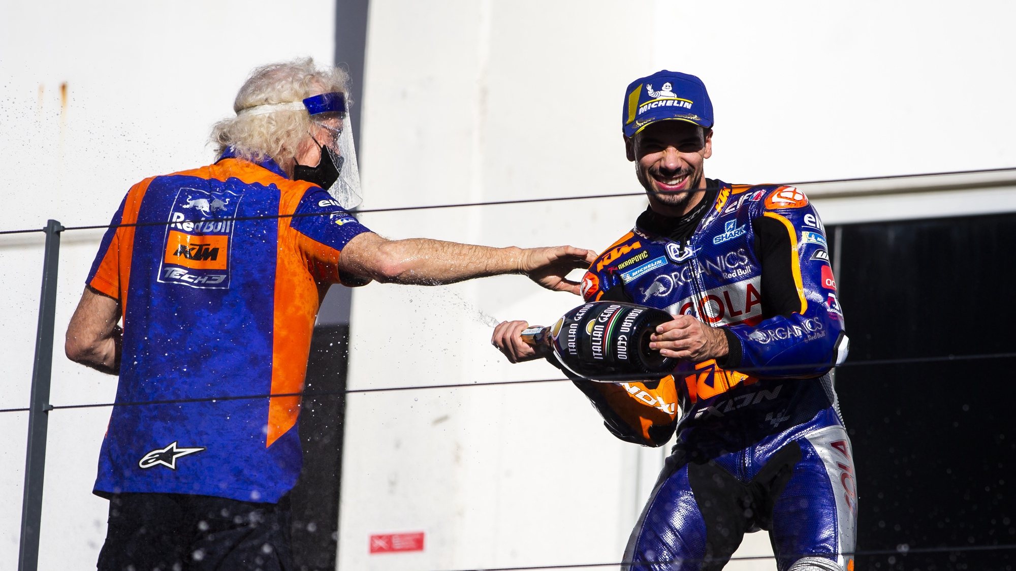 Portuguese rider Miguel Oliveira of KTM Tech 3 Team and KTM Tech 3 chief mechanic Guy Coulon celebrate on the podium after winning the Motorcycling Grand Prix of Portugal at Algarve International race track, south of Portugal, 22 November 2020.JOSE SENA GOULAO/LUSA