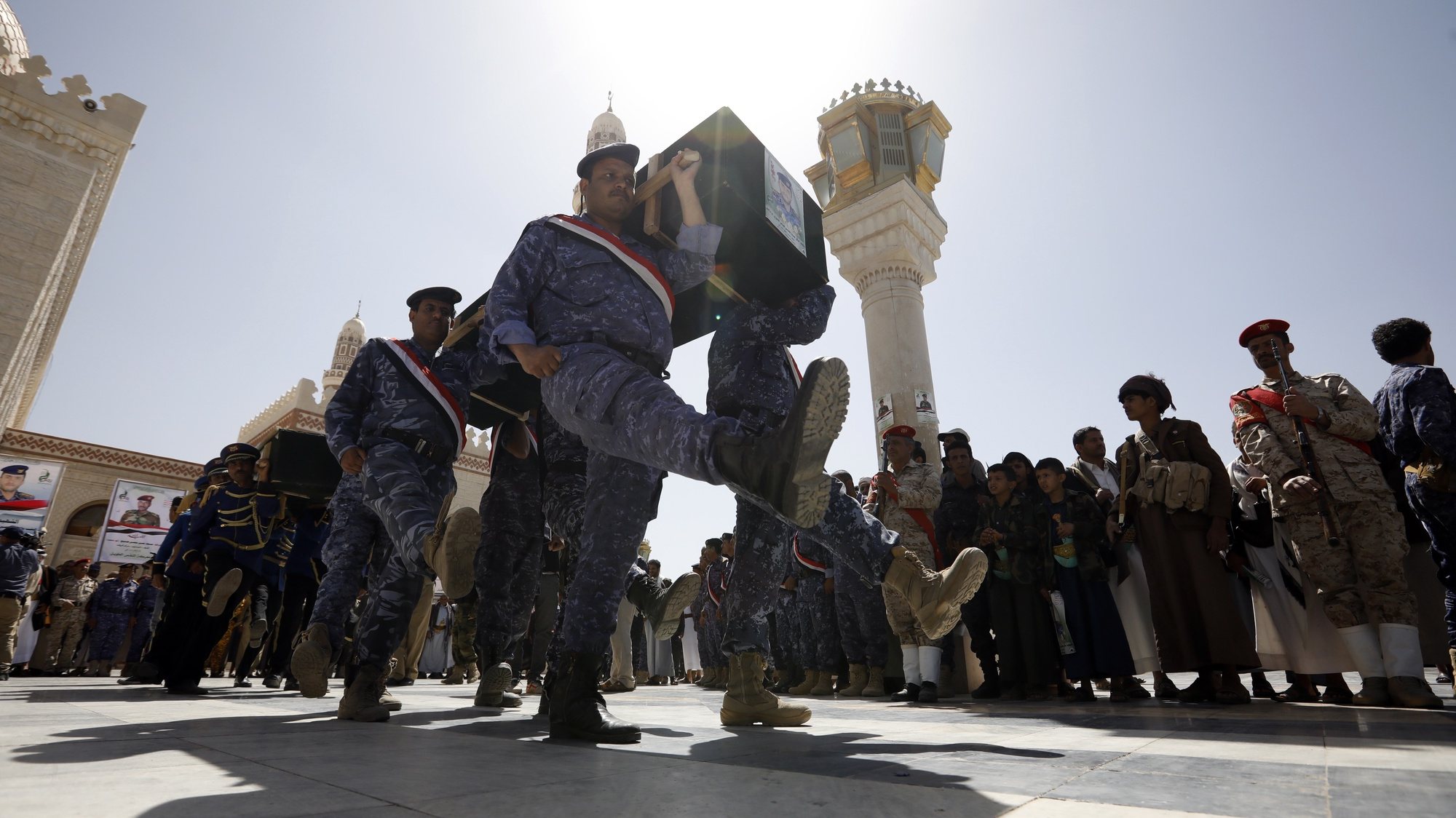 epa09091201 Pro-Houthi soldiers carry the coffins of slain Houthi fighters during a funeral procession a day after a Yemen peace initiative was offered by Saudi Arabia, in Sana&#039;a, Yemen, 23 March 2021. Saudi Arabia has offered a peace initiative to the Houthis in Yemen, including a ceasefire and the reopening of Sana’a airport. A Saudi-led coalition has been fighting the Houthis since March 2015.  EPA/YAHYA ARHAB