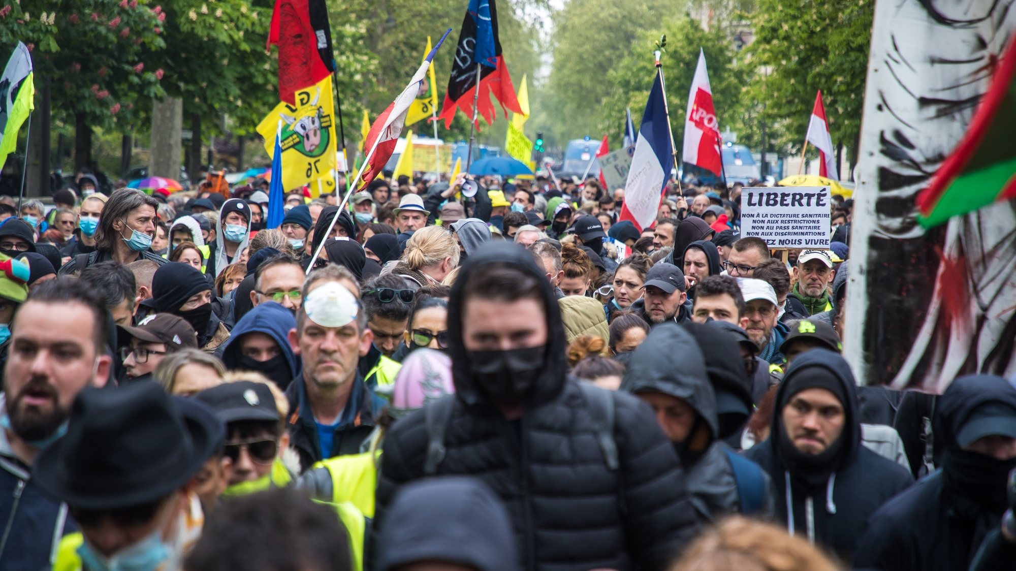 epa09172254 Members of the Gilets Jaunes movement march on their way to attend the annual May Day march in Paris, France, 01 May 2021. Labour Day, also known as International Workers&#039; Day or May Day, is observed worldwide on 01 May.  EPA/CHRISTOPHE PETIT TESSON